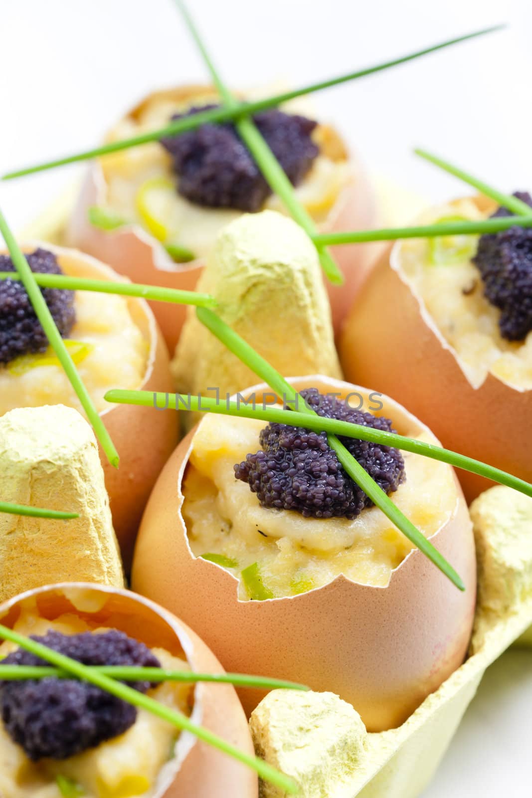 scrambled eggs with chives and black caviar
