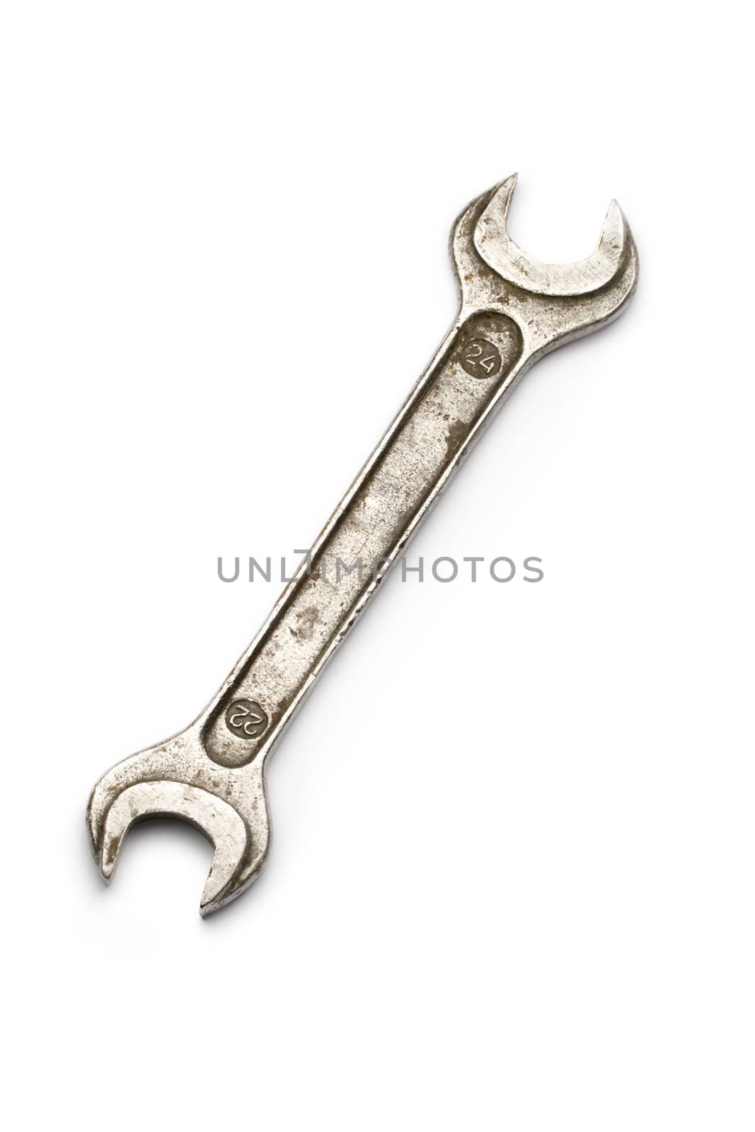 Metallic wrench isolated on white by Garsya