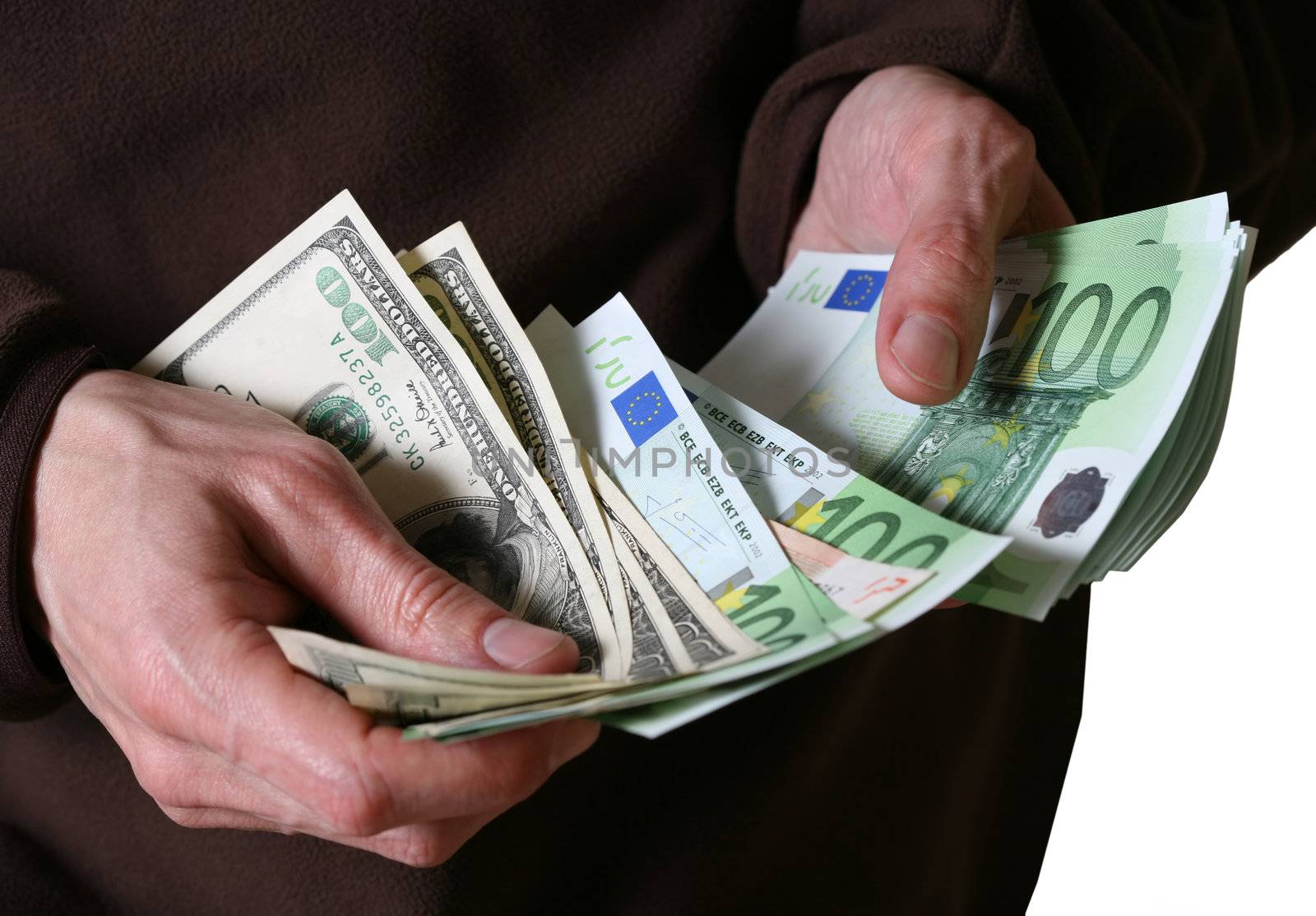 Man's hands hold Euro and dollars banknotes money