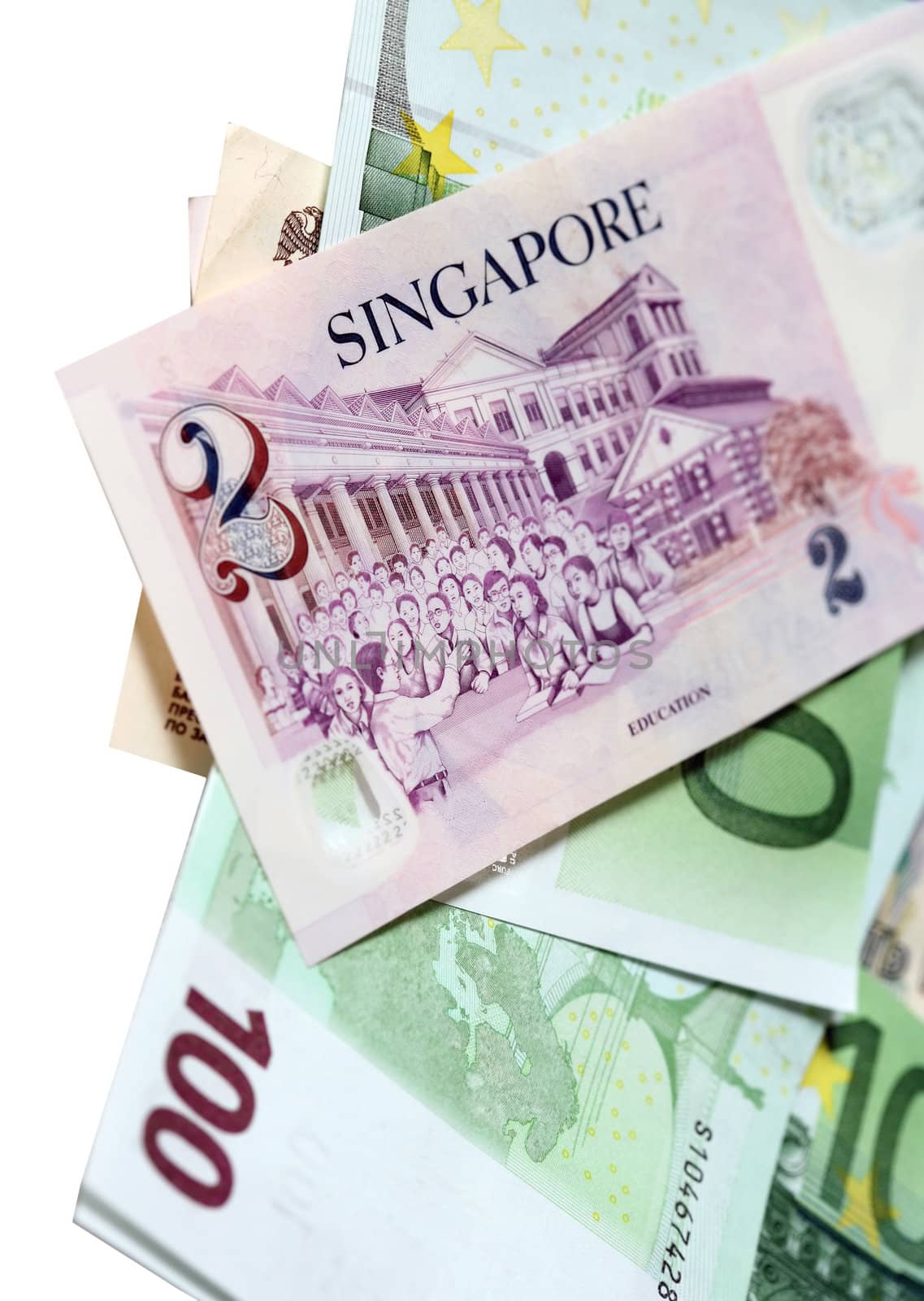 Two singapore dollars and banknotes euro