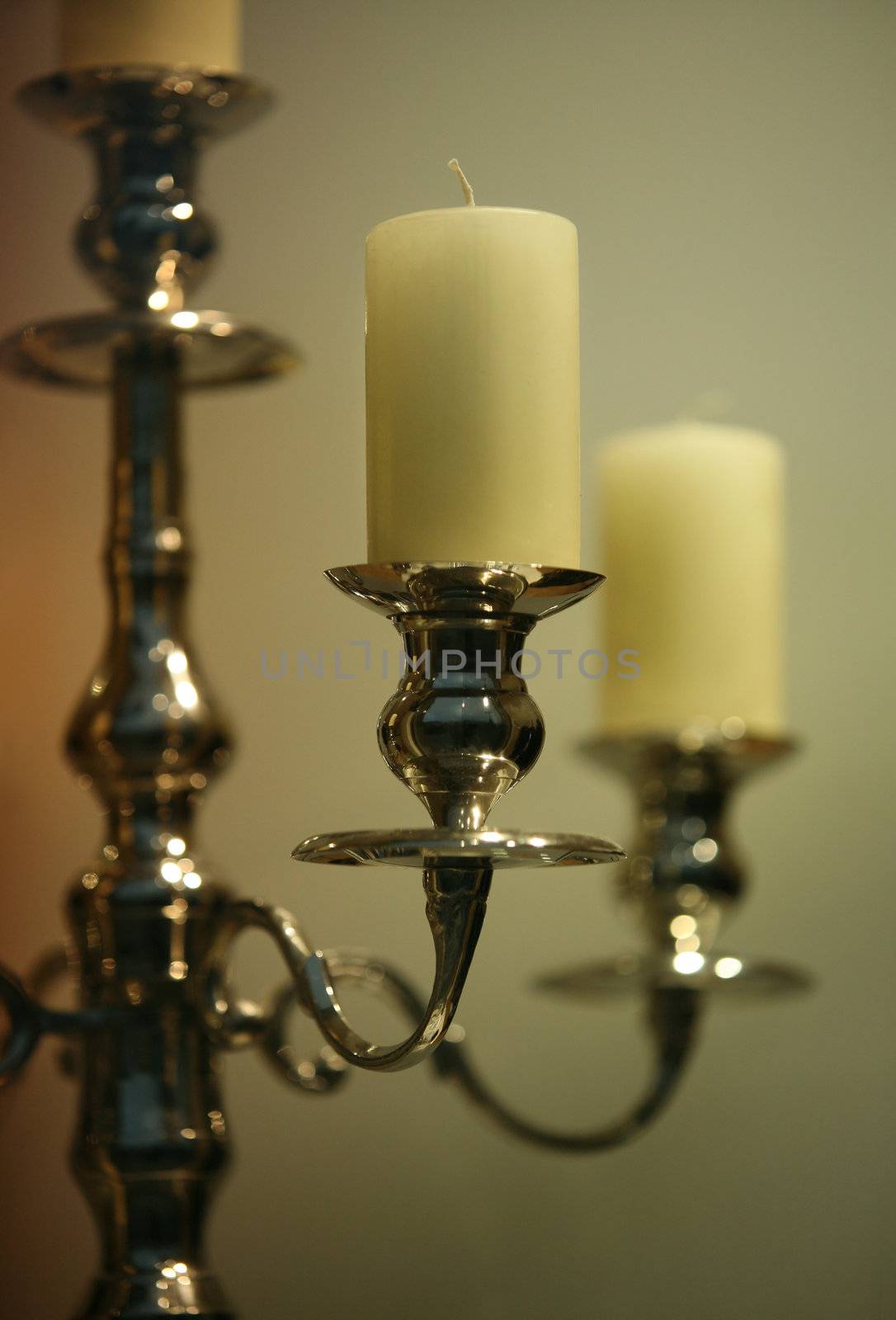 The not lit candles in ancient gold candelabrum