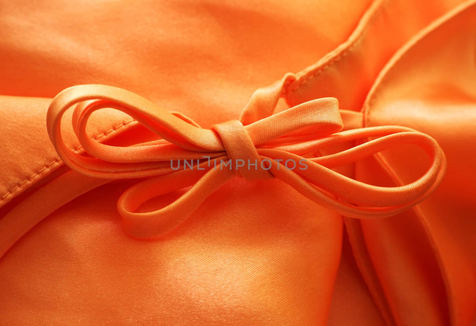Silk textile background with a bow