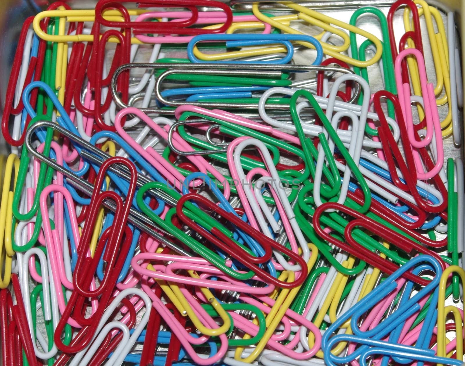 colored paperclips in box