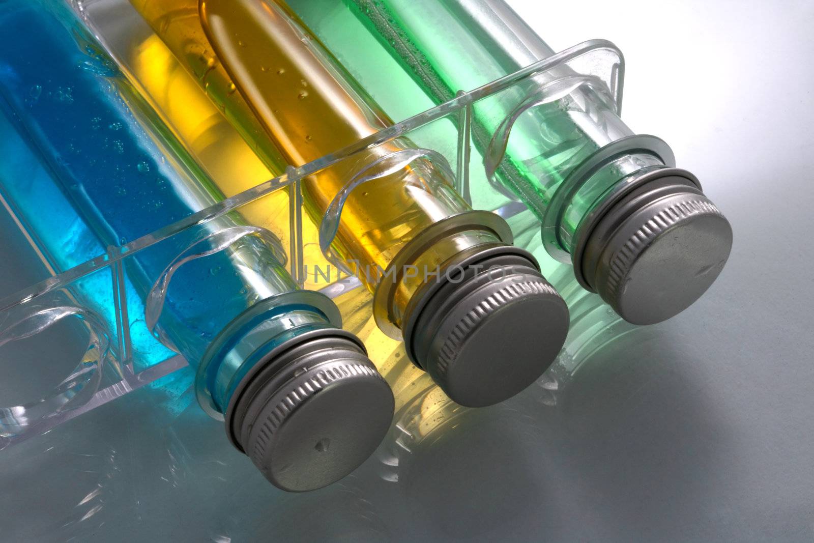 Test tubes with a dark blue, green and yellow liquid