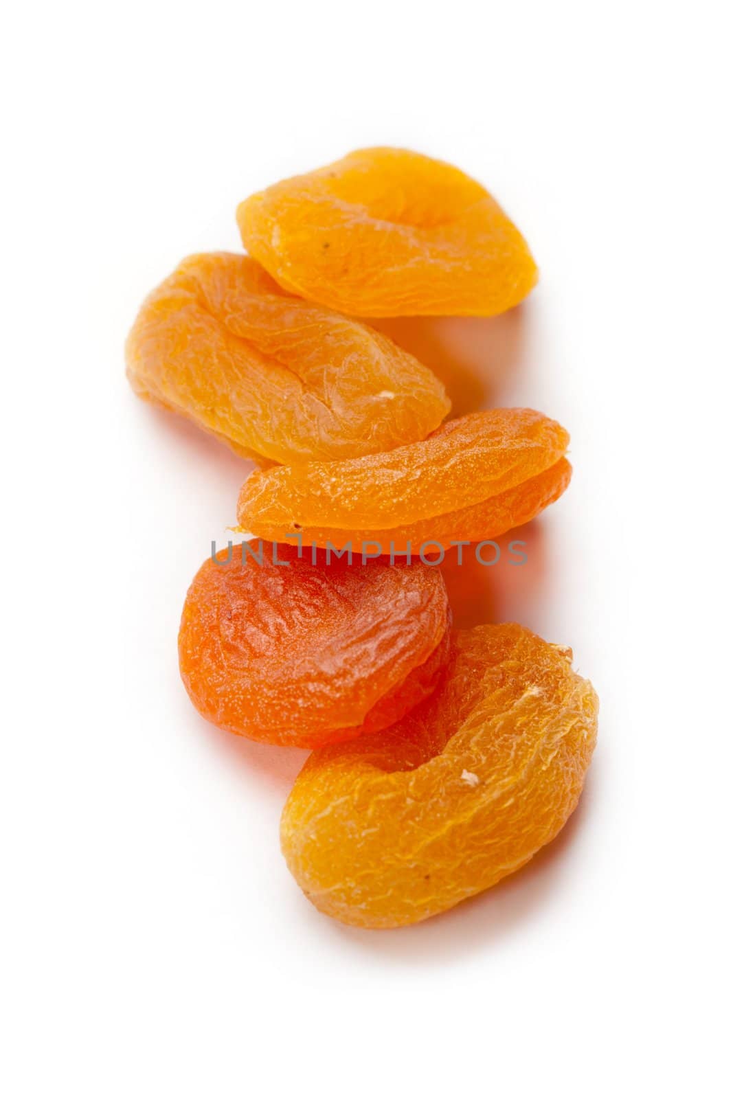 Dried apricots isolated on white background by Garsya