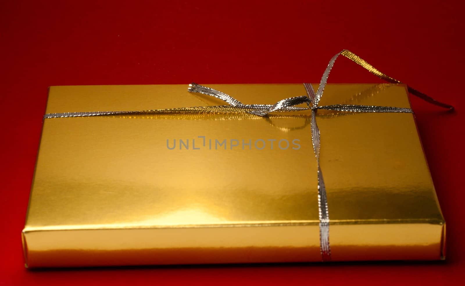 Gift box isolated on red