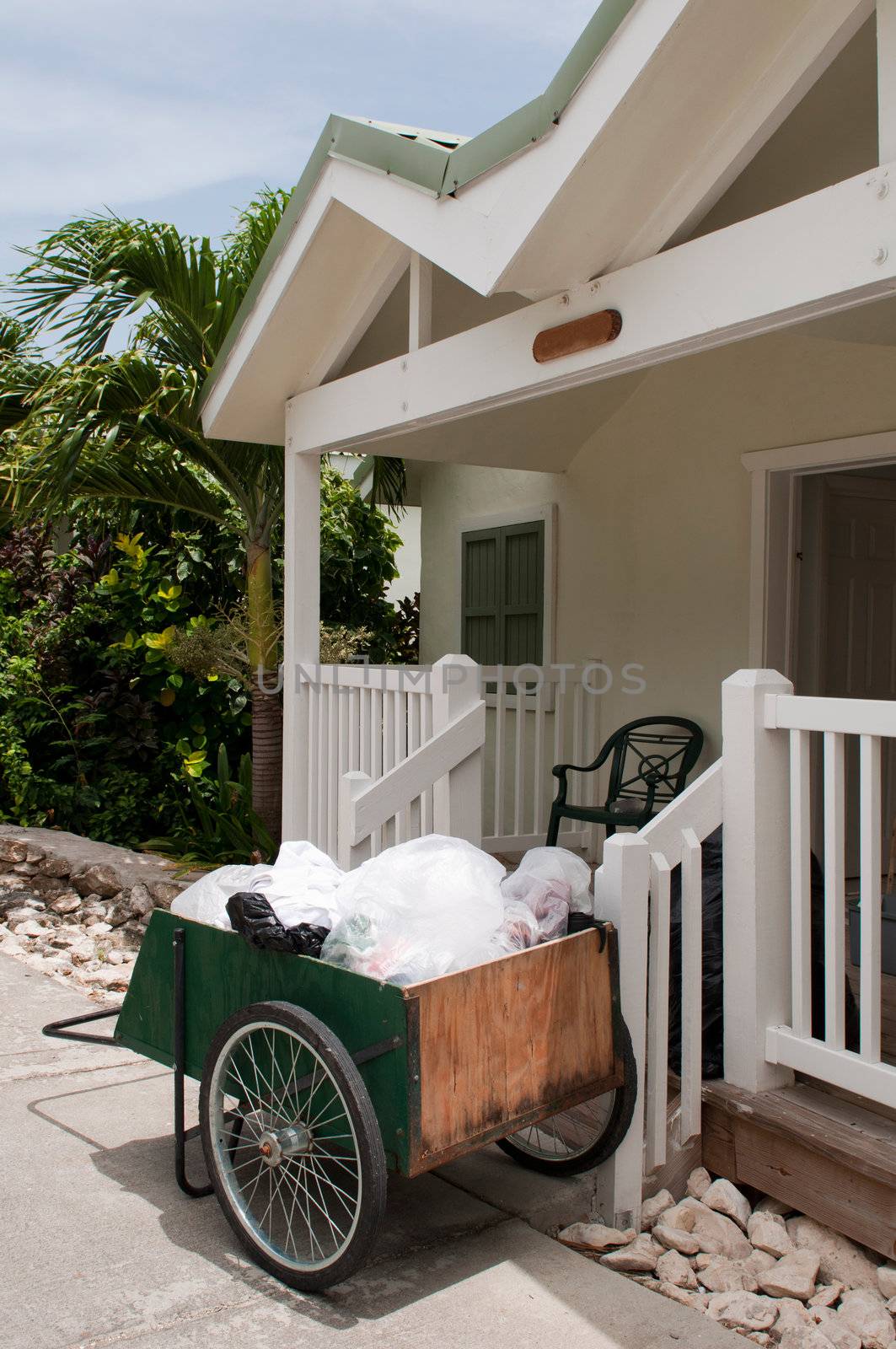 antique cleaning cart outside tropical resort villa (in the carribean)