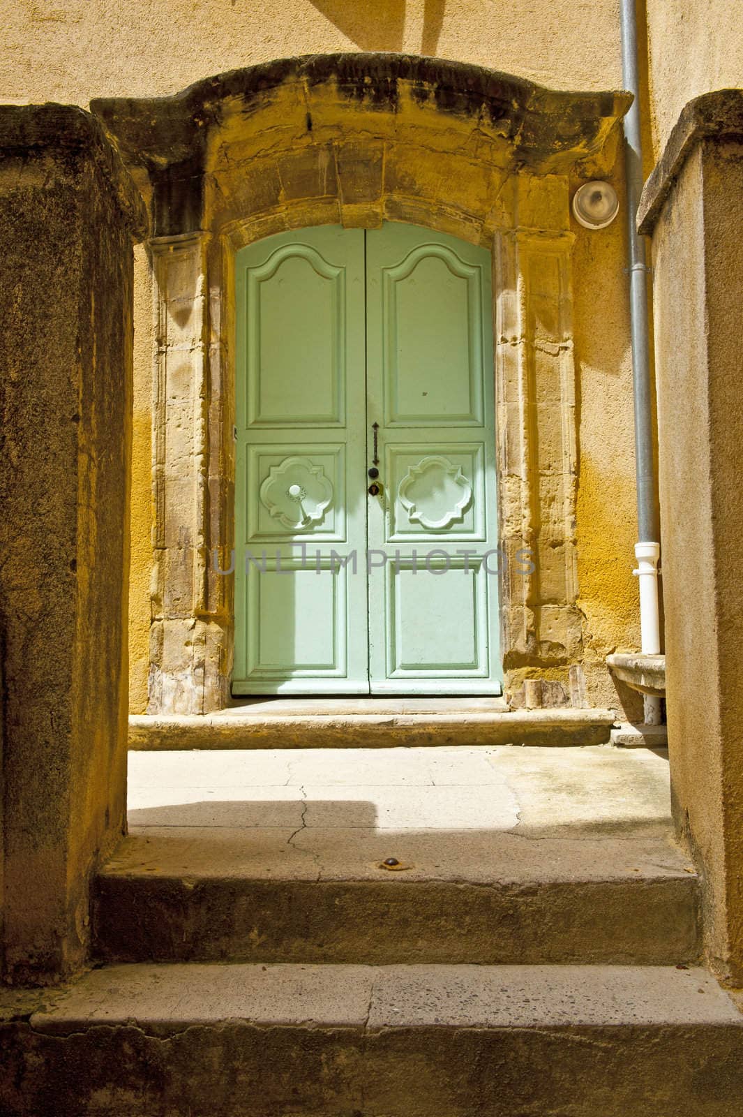 Wooden Door to the Patio in the French City