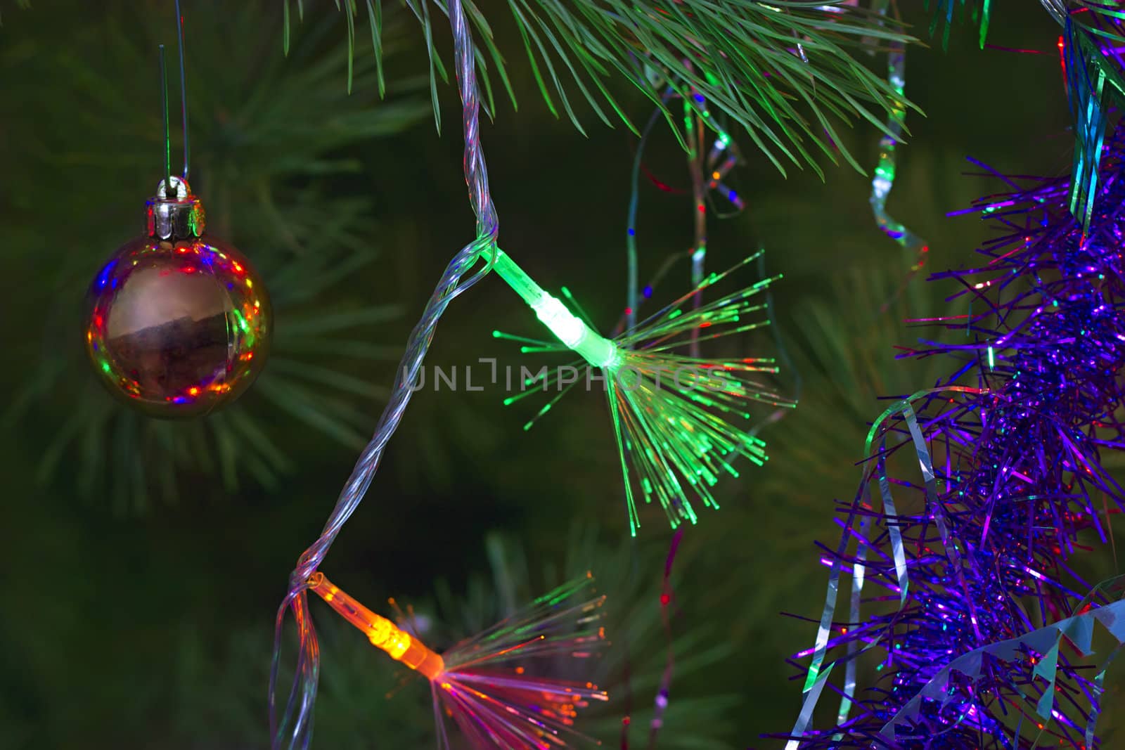 Christmas background of tinsel and garlands on the tree