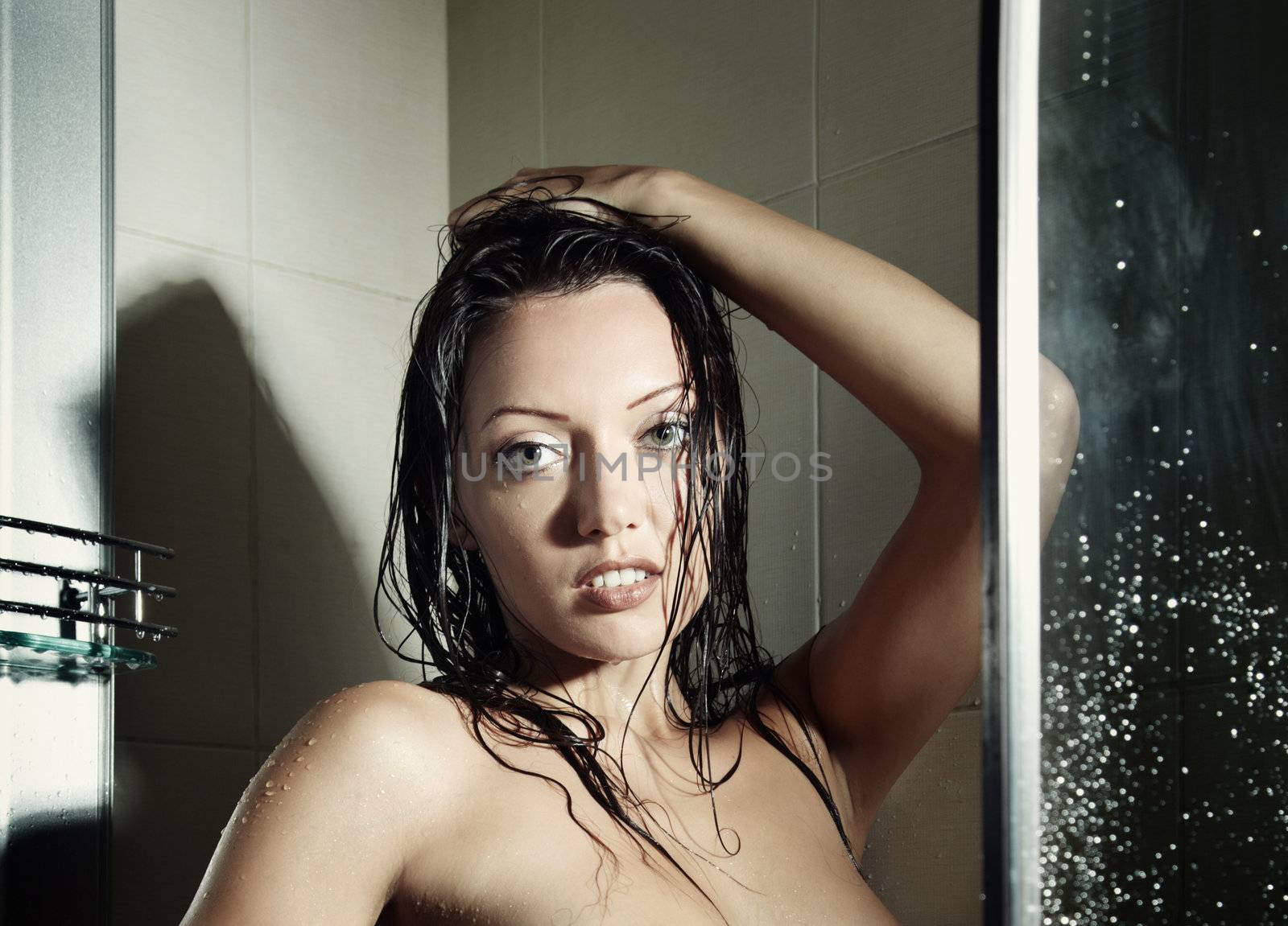 Sensual wet woman in the bathroom after washing