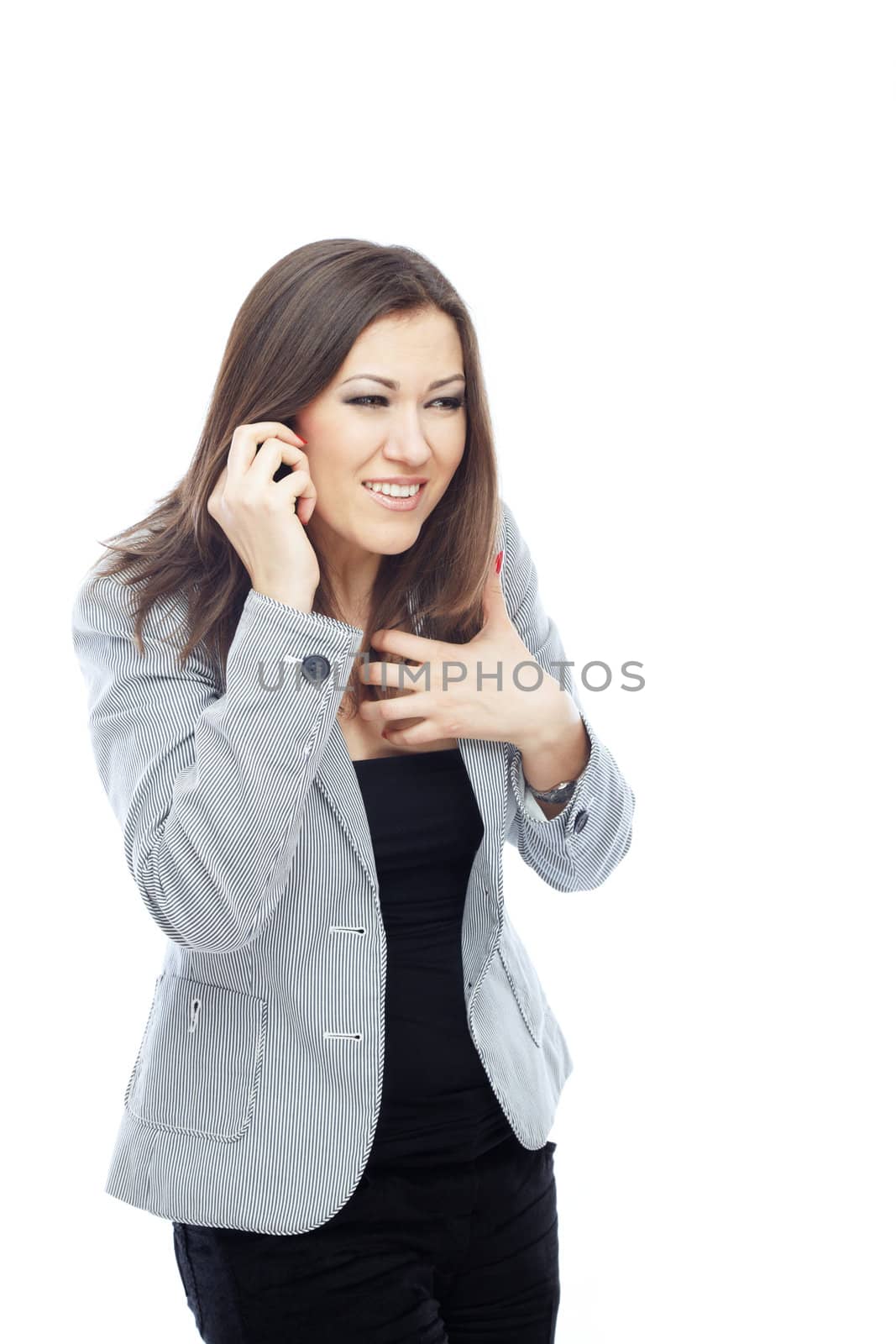 Business woman on a white background talking via mobile phone