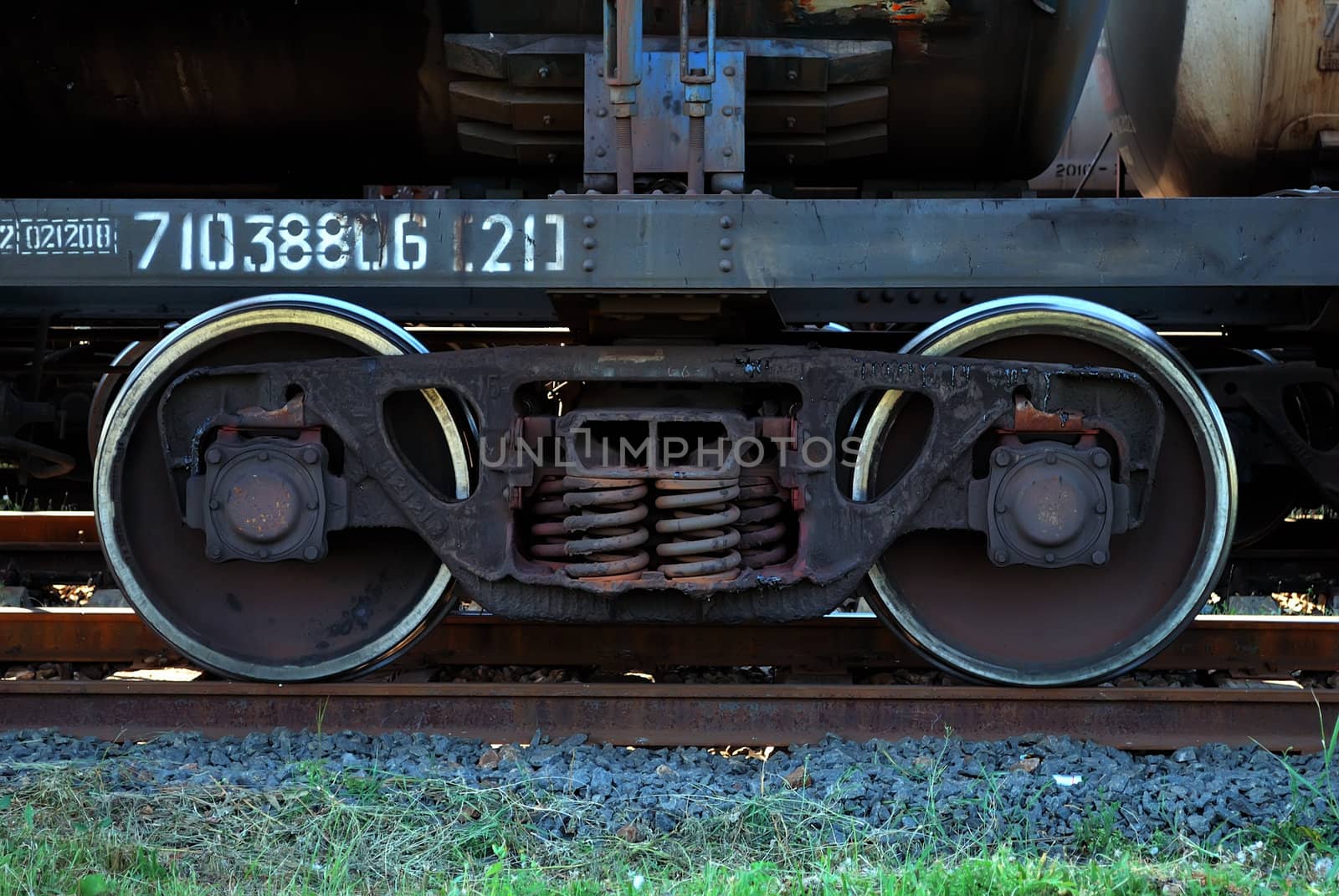 rusty train wheels on rails. close-up