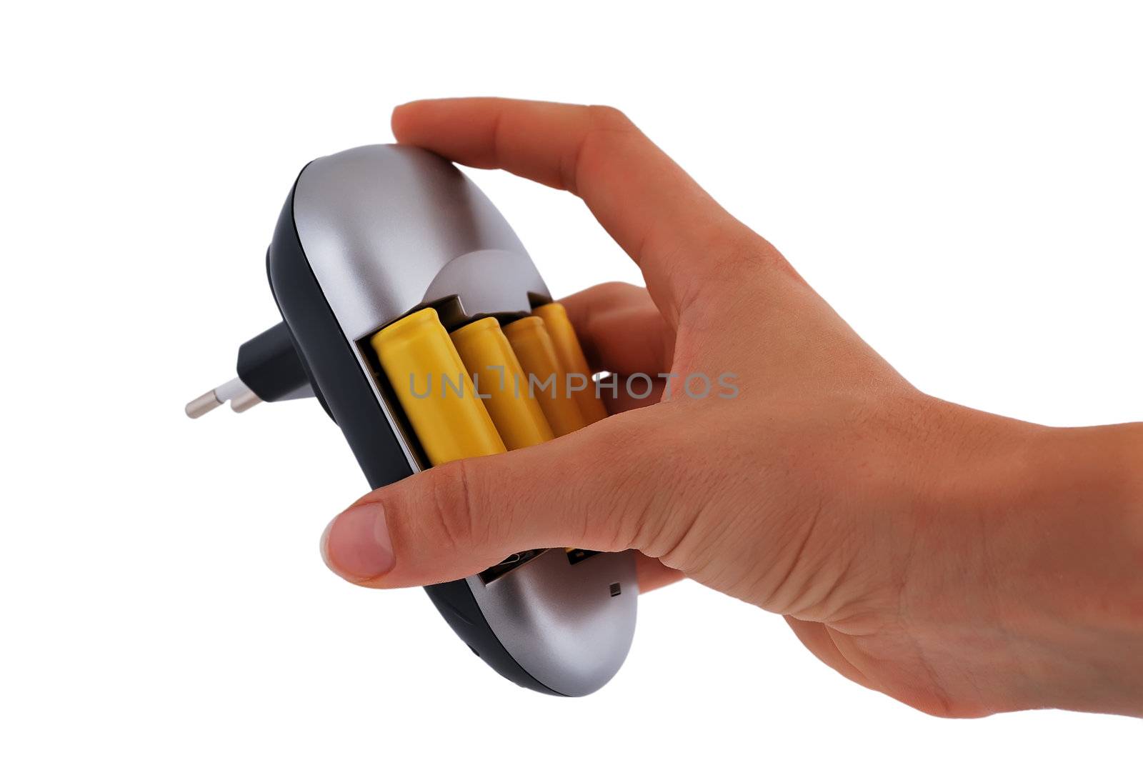 Charger with yellow batteries in hand on a white background