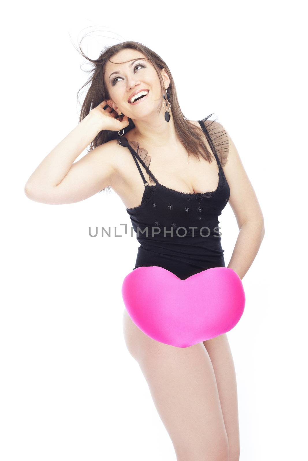 Happy sexy lady with Valentine heart on a white background