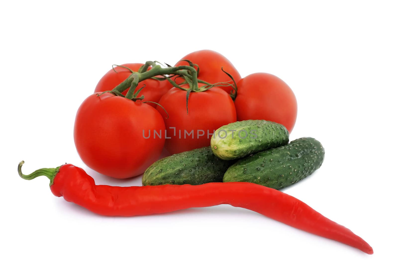 tomatoes, cucumbers and peppers on a white background