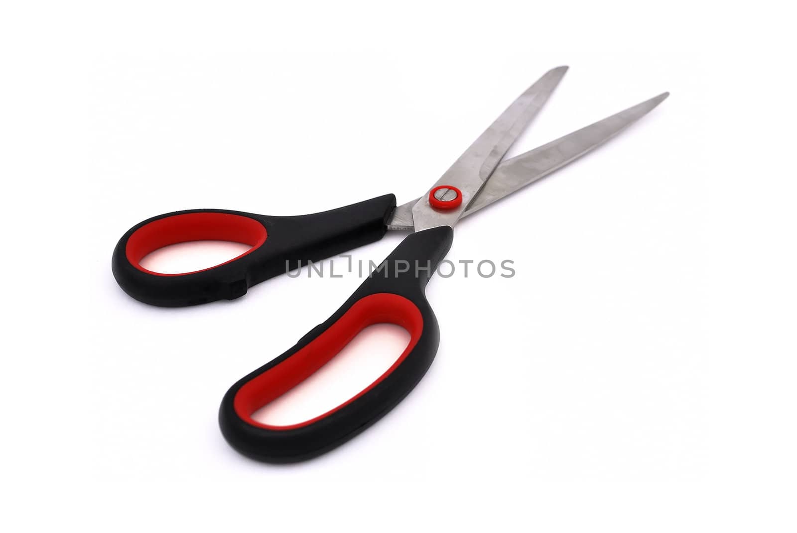 scissors with black and red handle on a white background