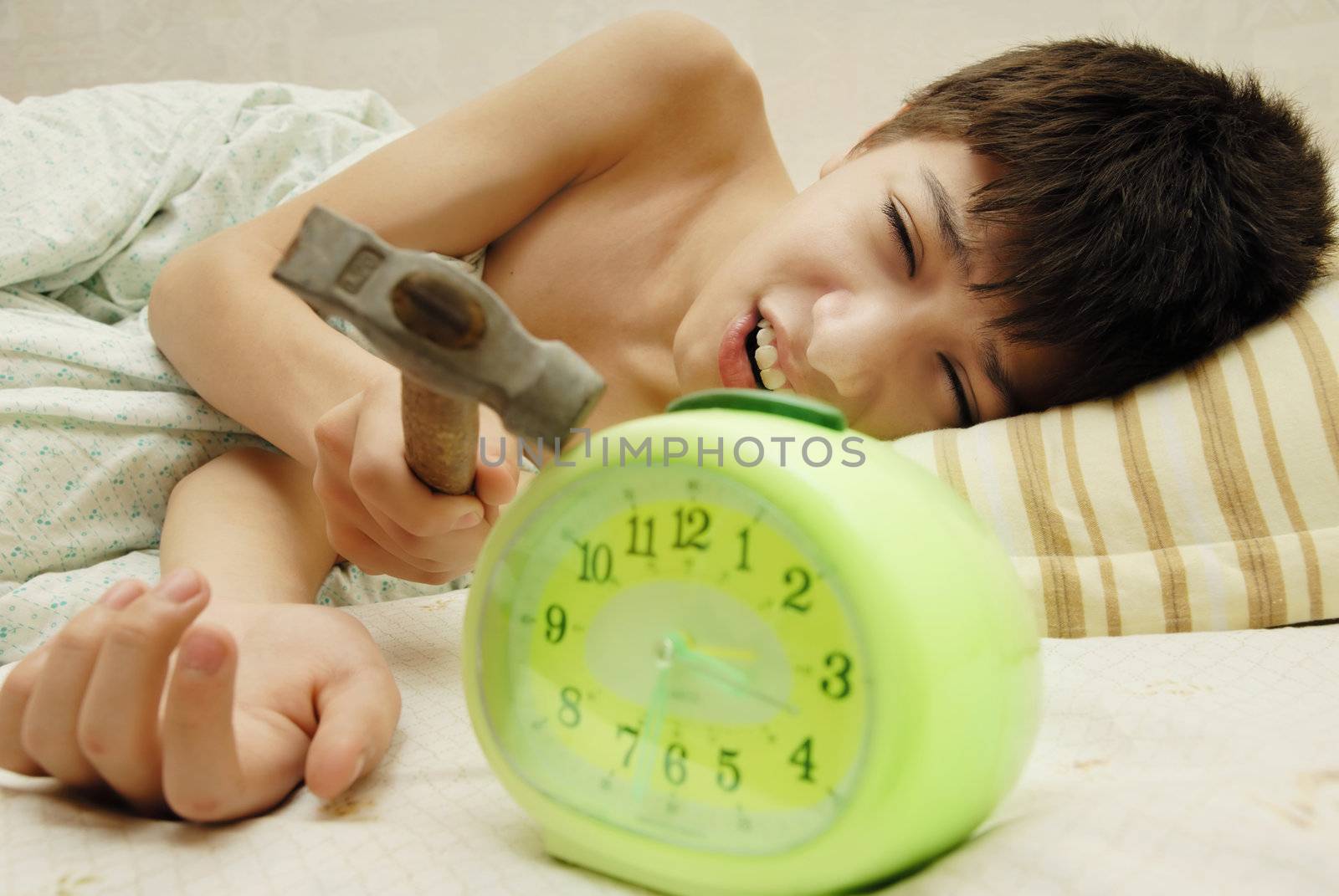 Daily morning battle between boy and alarm clock