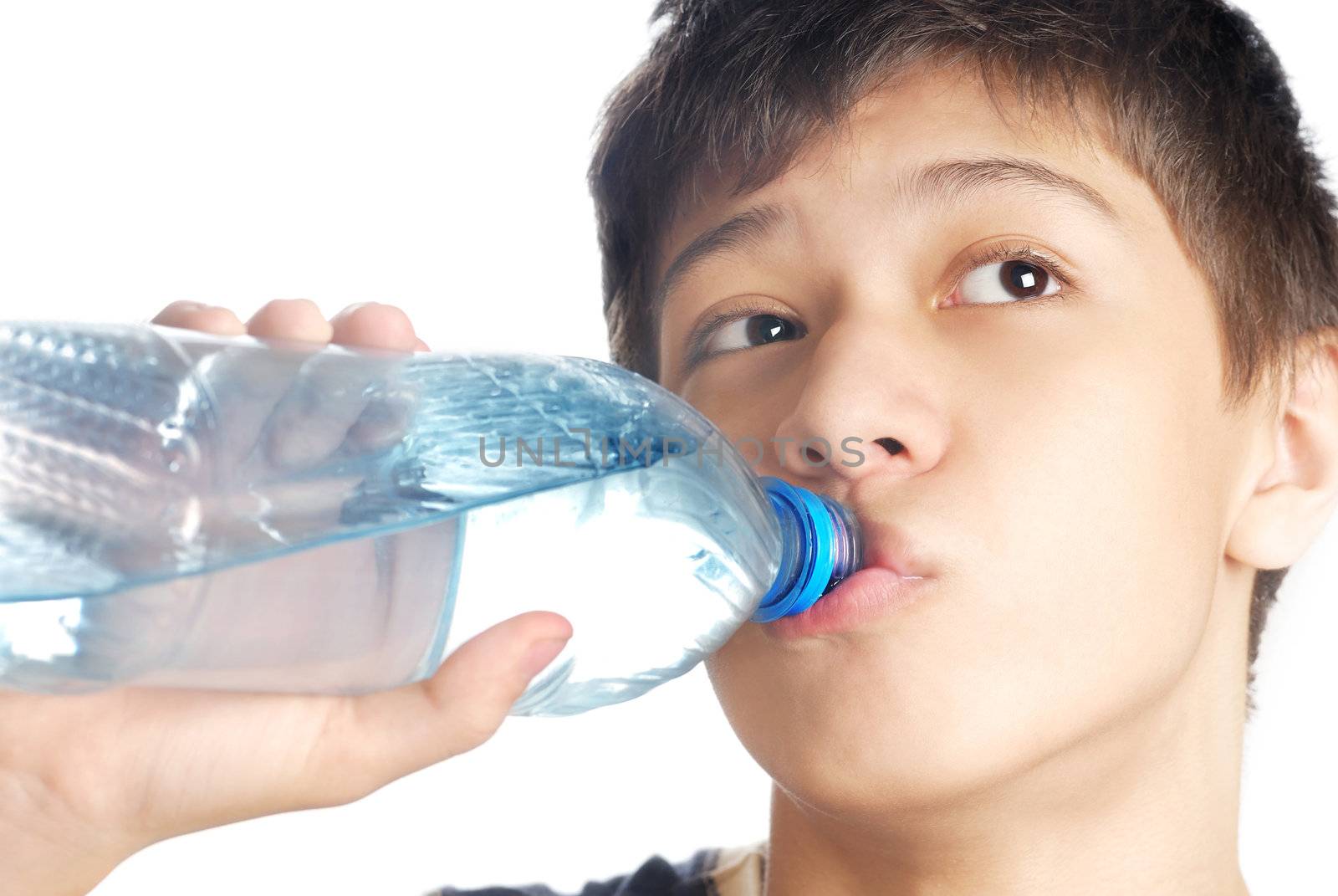 Boy drinking the mineral water after exercise