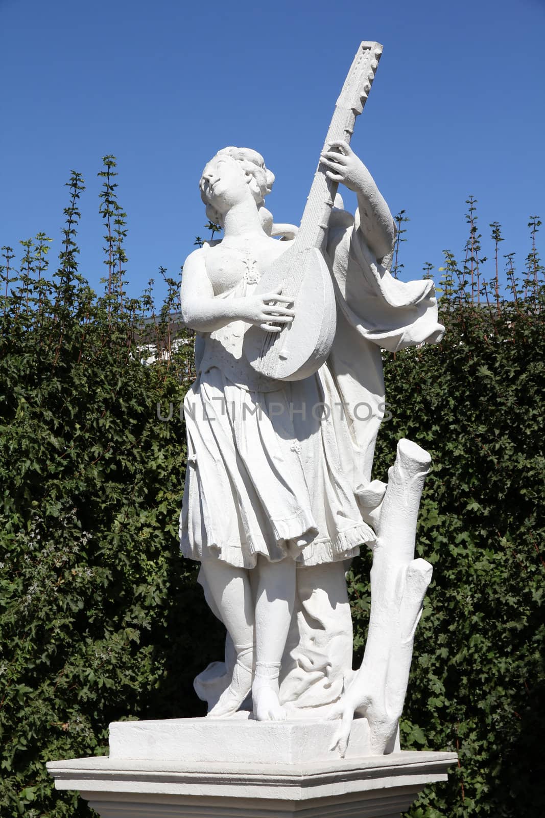Vienna, Austria - statue of music player in Belvedere Gardens, a UNESCO World Heritage Site.