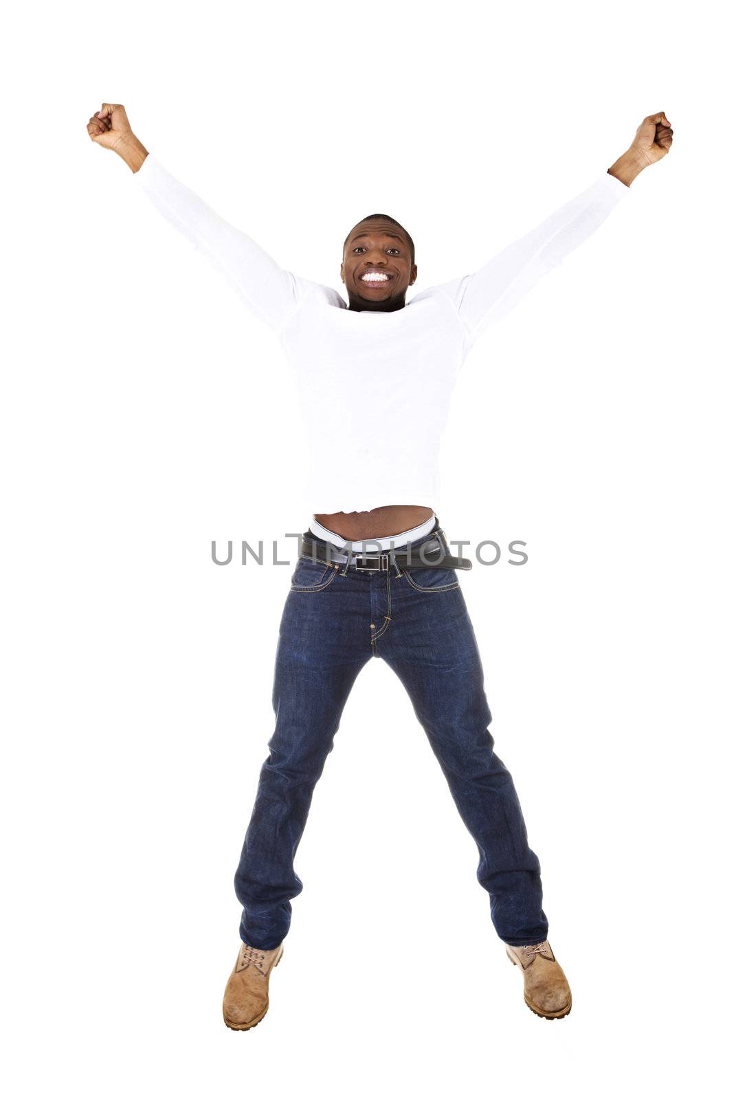 Young happy afro american man jumps in joy over white background.