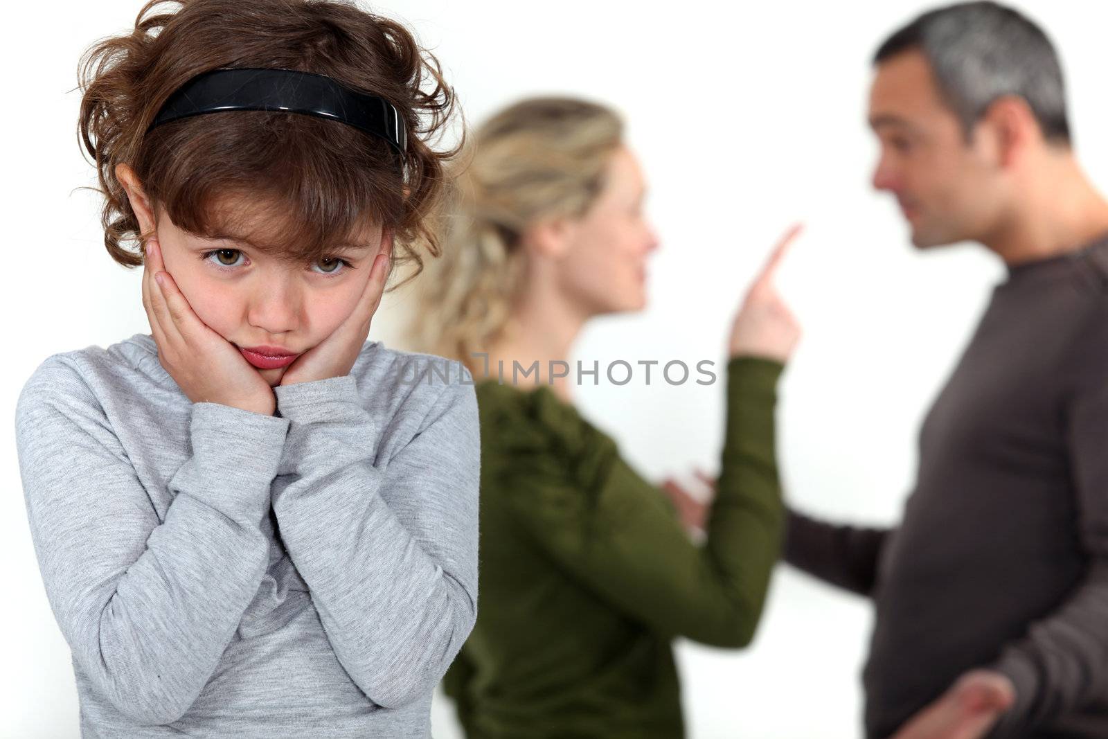 cute little girl distressed over parents' quarrel by phovoir