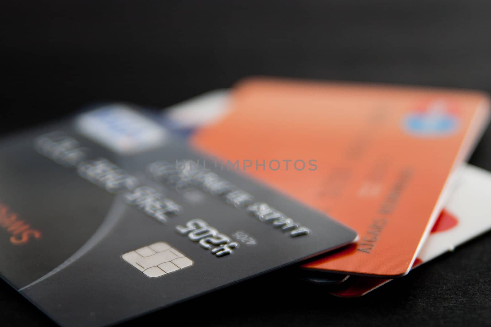 Stack of credit cards on a black background