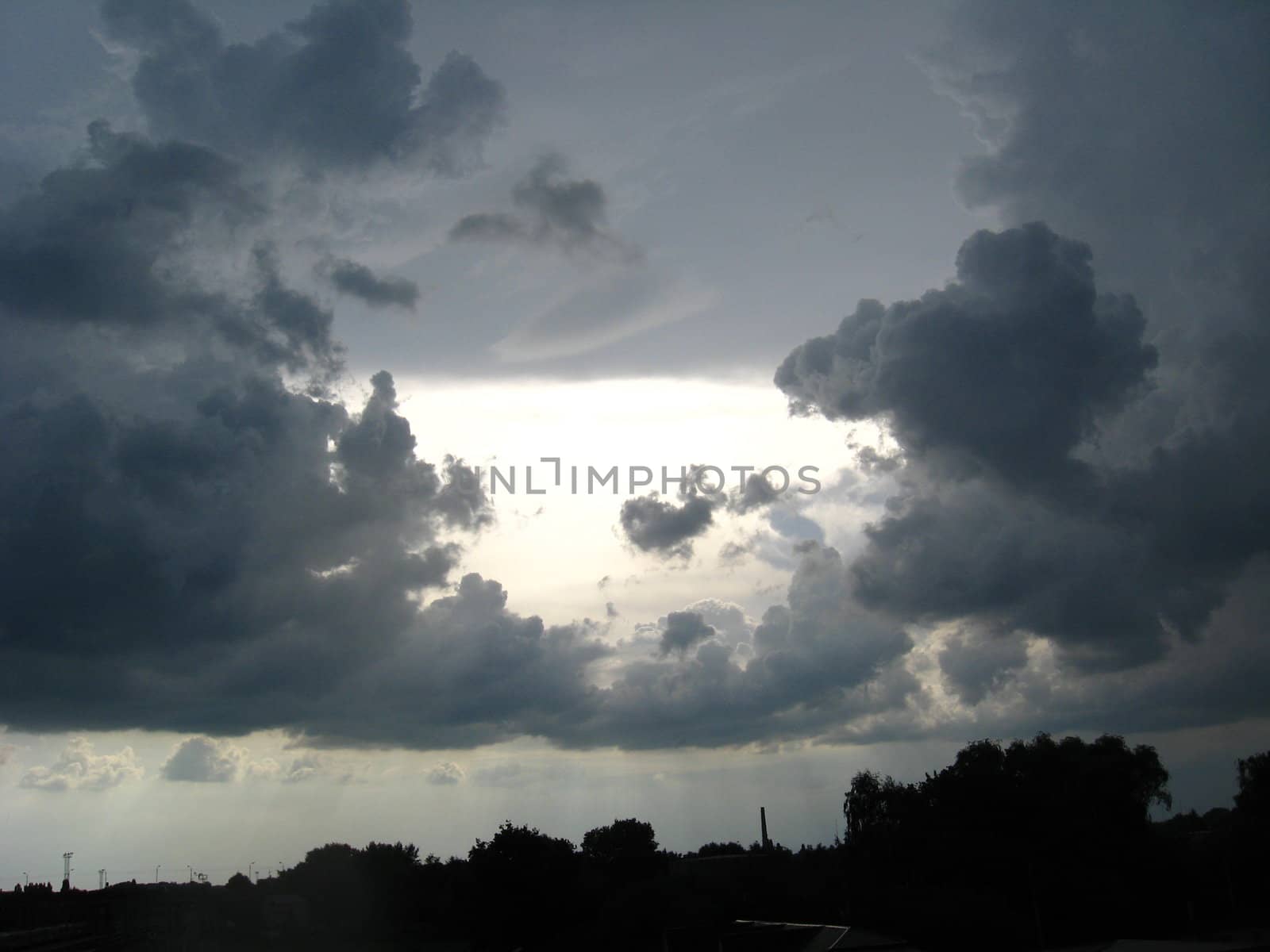 Evening landscape with beautiful picturesque clouds