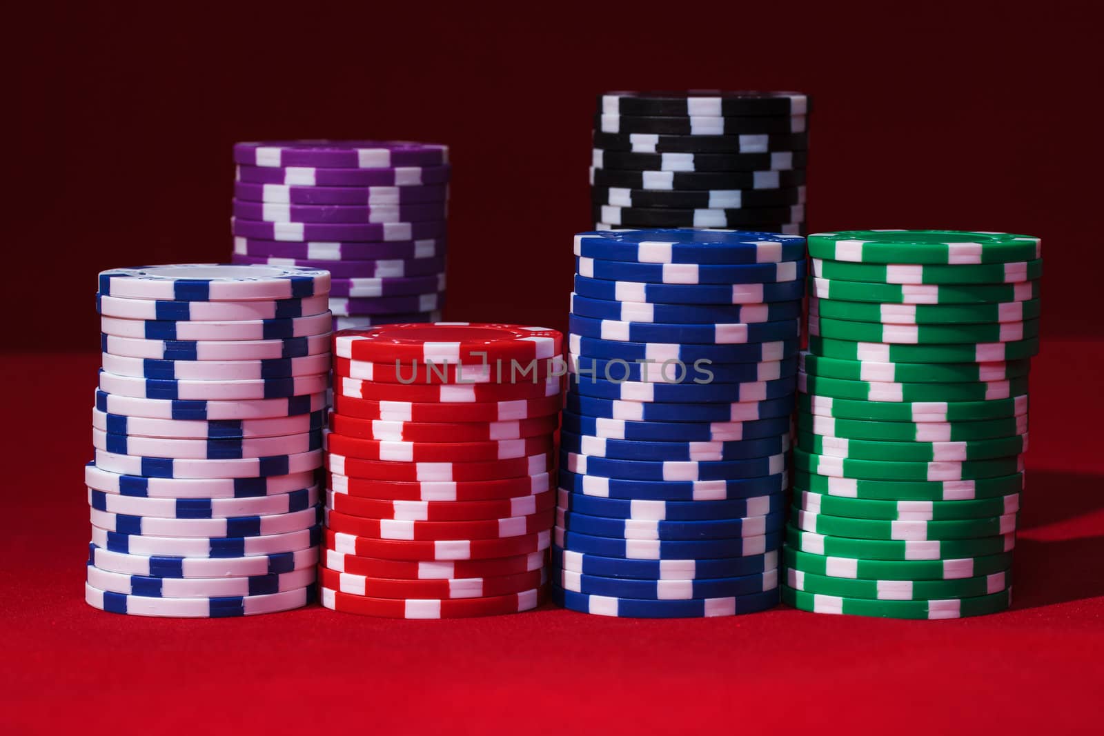 Stacks of Multicolored Poker Chips by Discovod