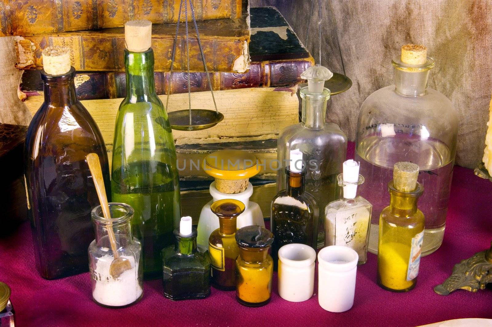 Still life with old books and apothecary dishes