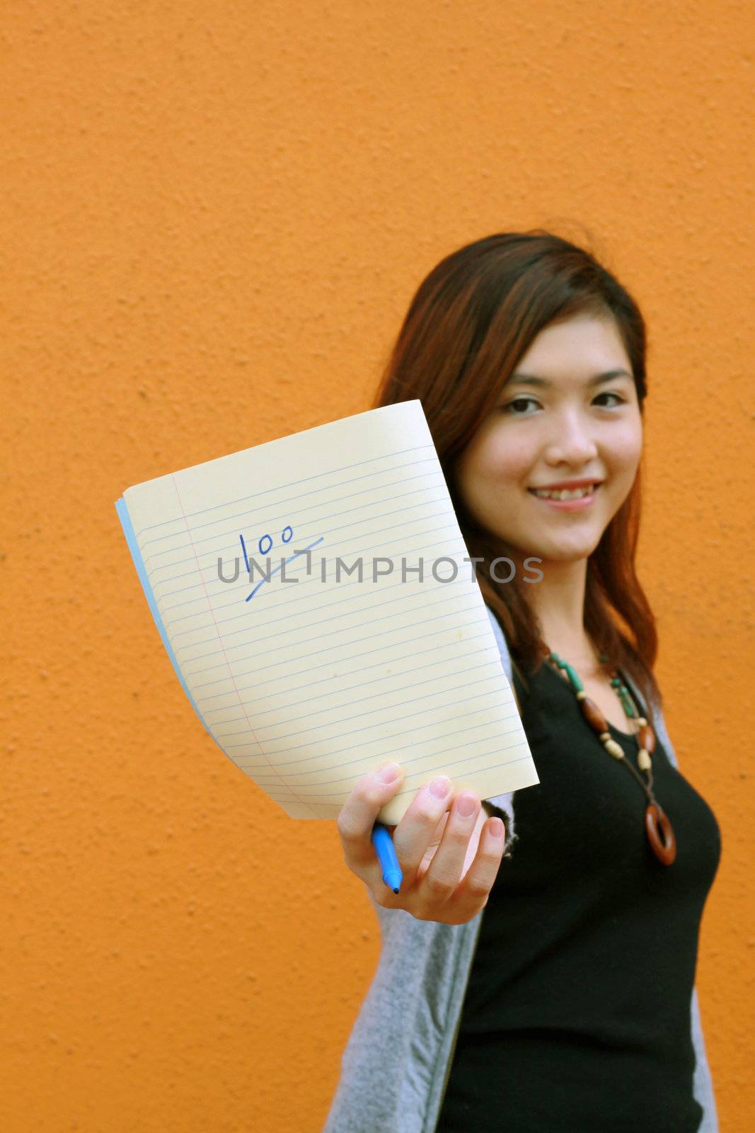 Asian university student showing full marks
