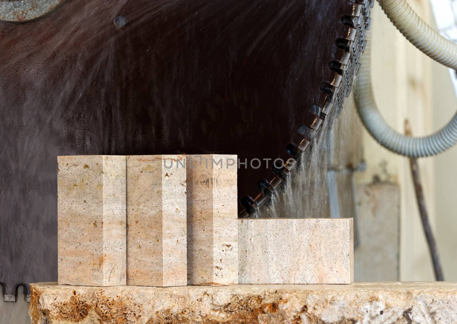 limestone blocks, against the background of a running cutter for cutting stone