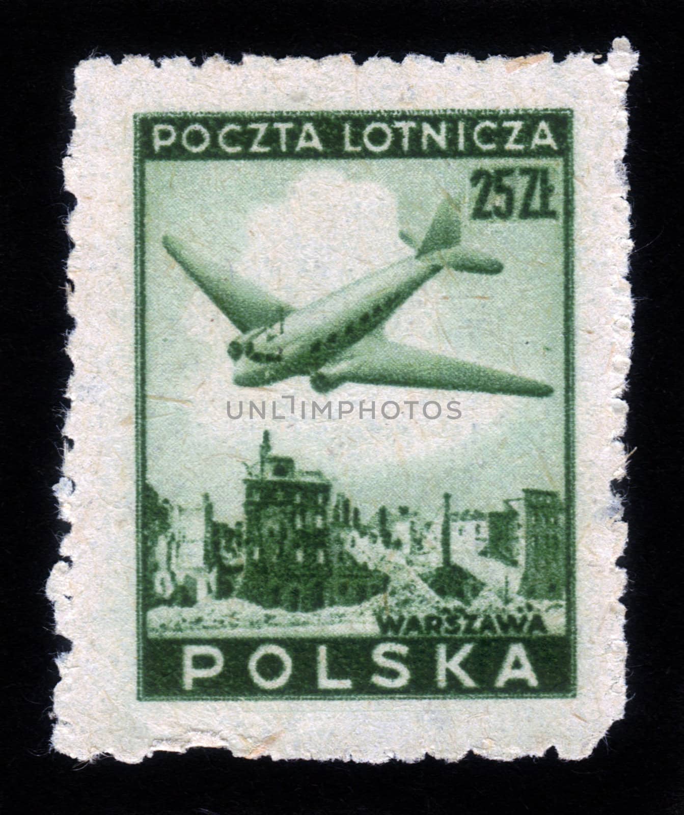 POLAND - CIRCA 1952: A stamp printed in Poland shows airplane over Warsaw ruins , circa 1952