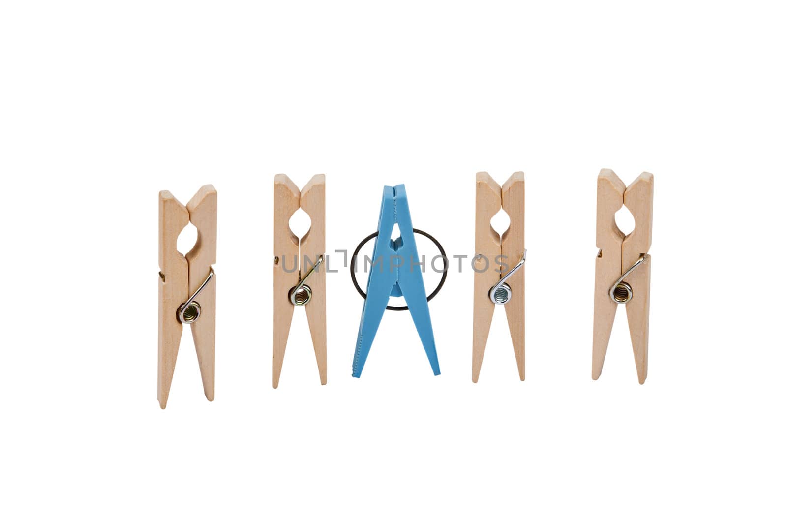 Closeup of five clothespins placed vertically in line. Four clothespins - wood, in the center is a blue plastic clothespins. Image is isolated on white and the file includes a clipping path.