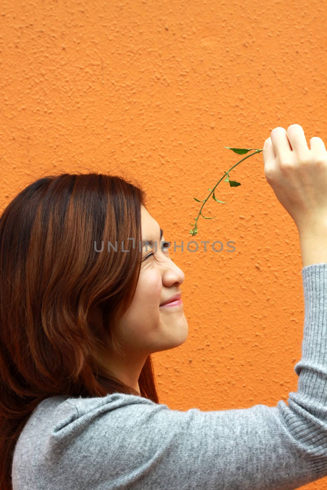 Chinese girl playing grasses