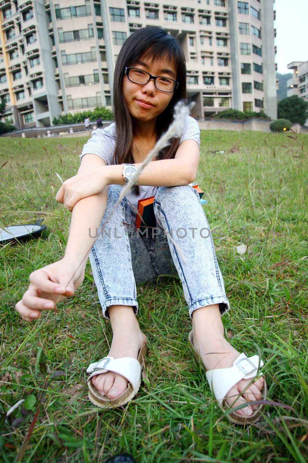 Chinese girl playing grasses
