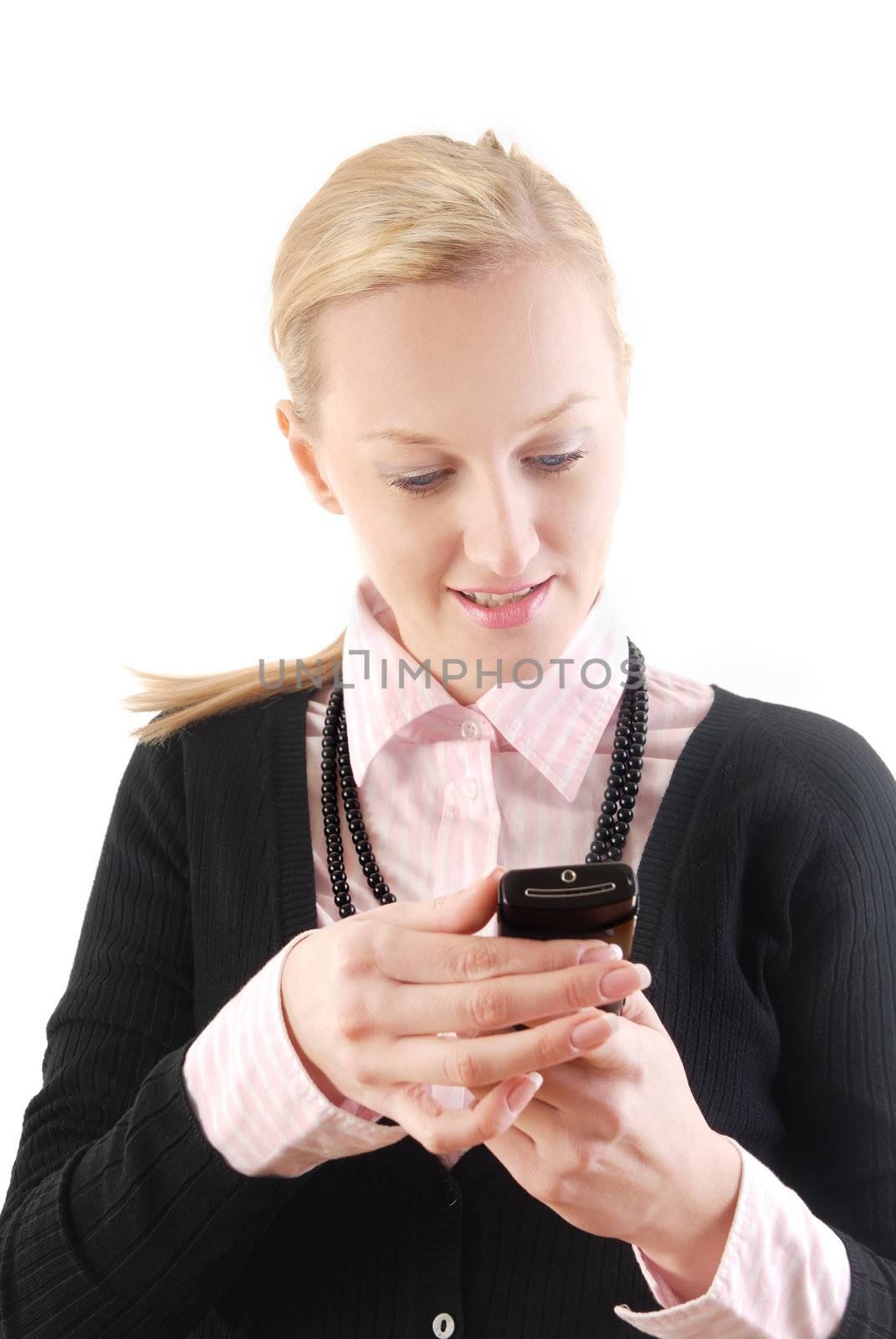 Businesswoman reading or writing SMS via cellular phone