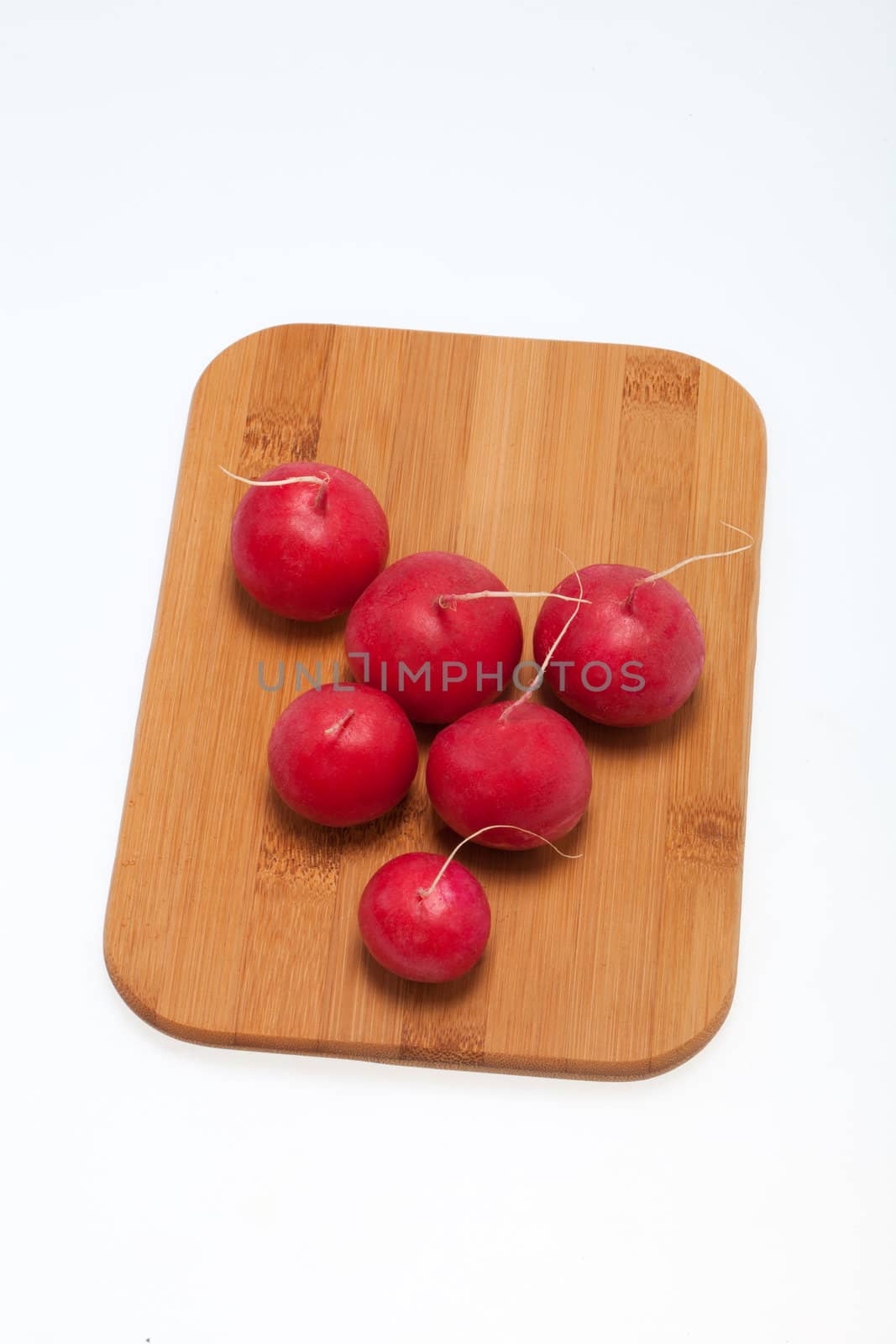 Garden radish on wooden board 