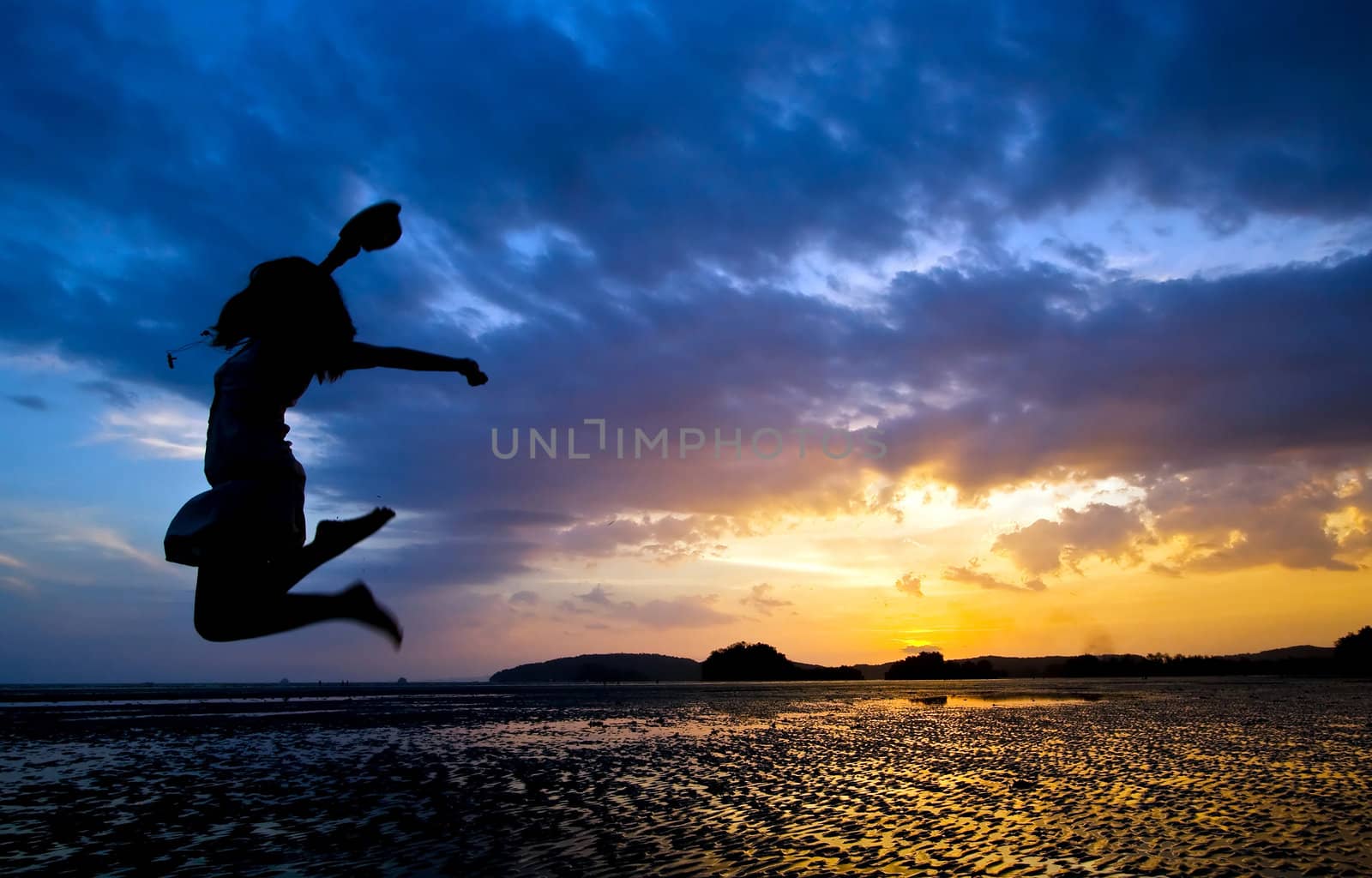 jumper at beach sunset by vichie81