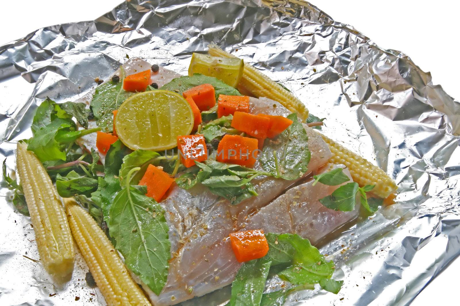 Preparation of Raw White sea bass with herb,corn carrot sweet basil and lime in Traditional Thai Style