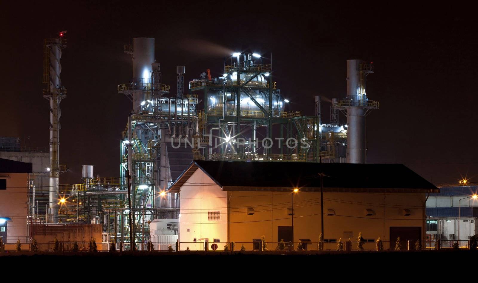 oil refinery factory with storage tank and warehouse