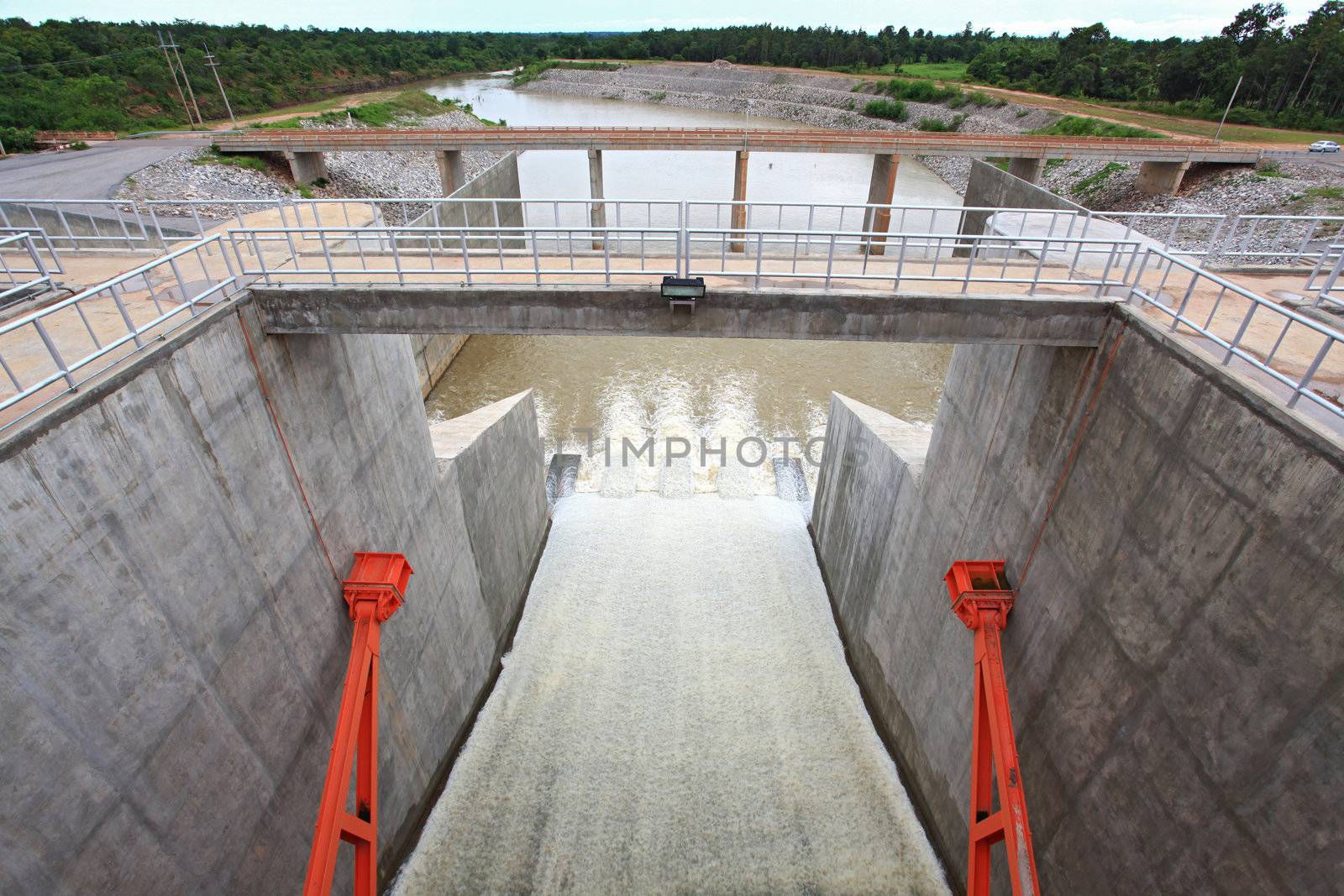 Water pouring through the water gates at dam