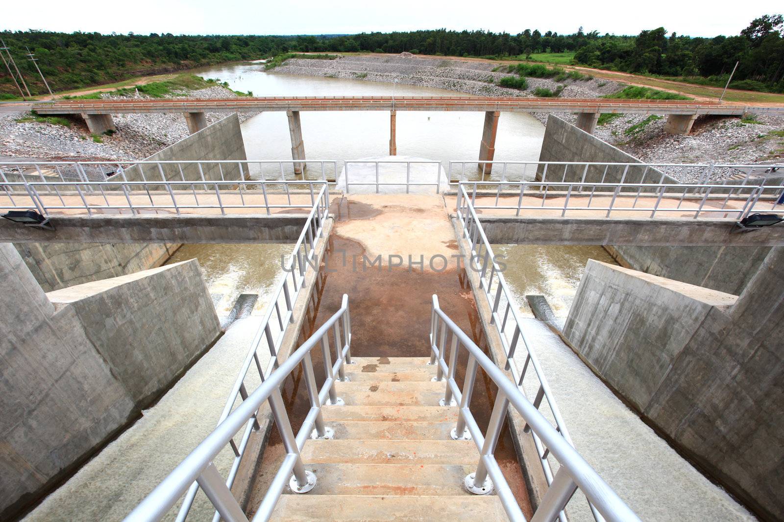 Water pouring through the water gates at dam