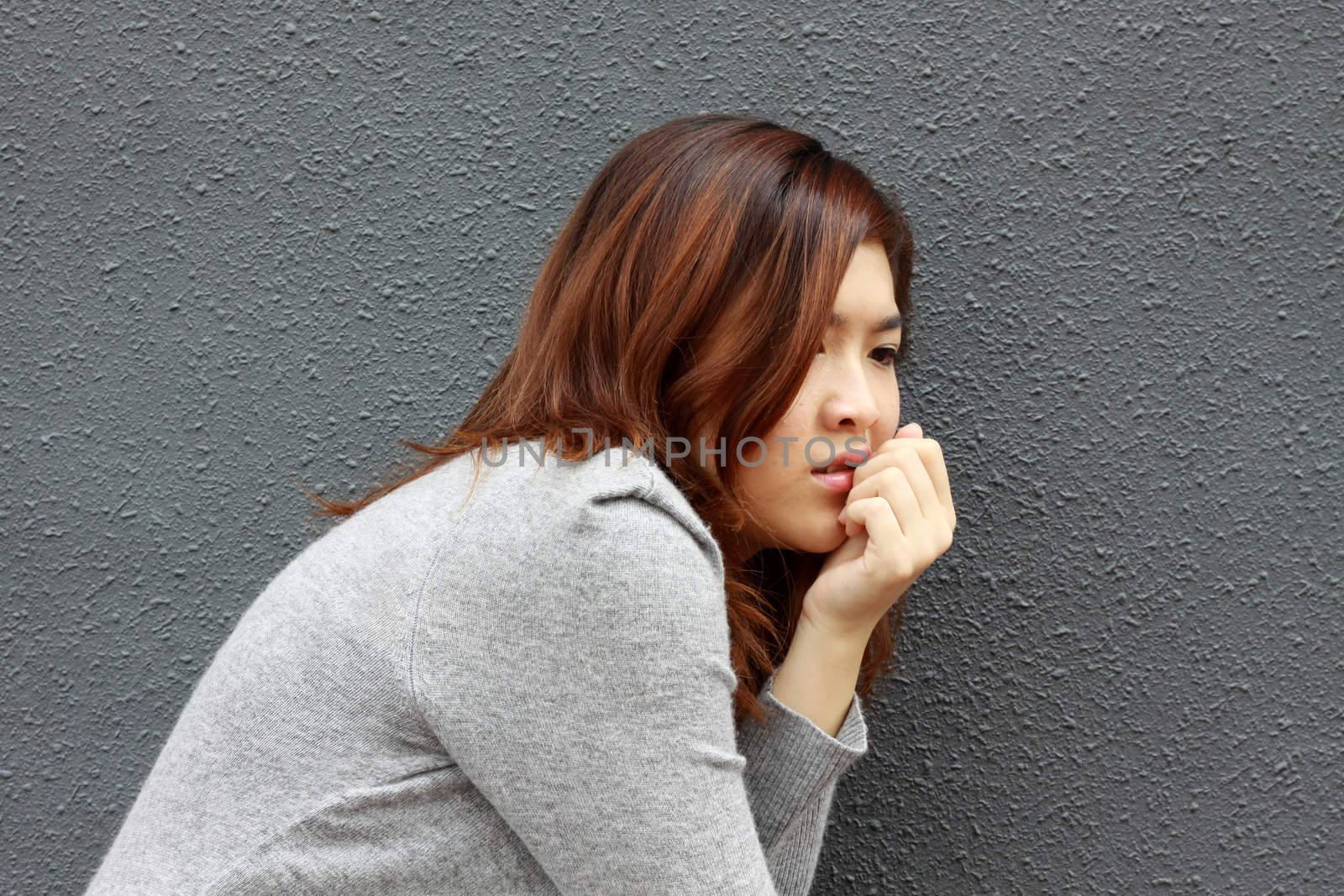 Asian woman with frightened face