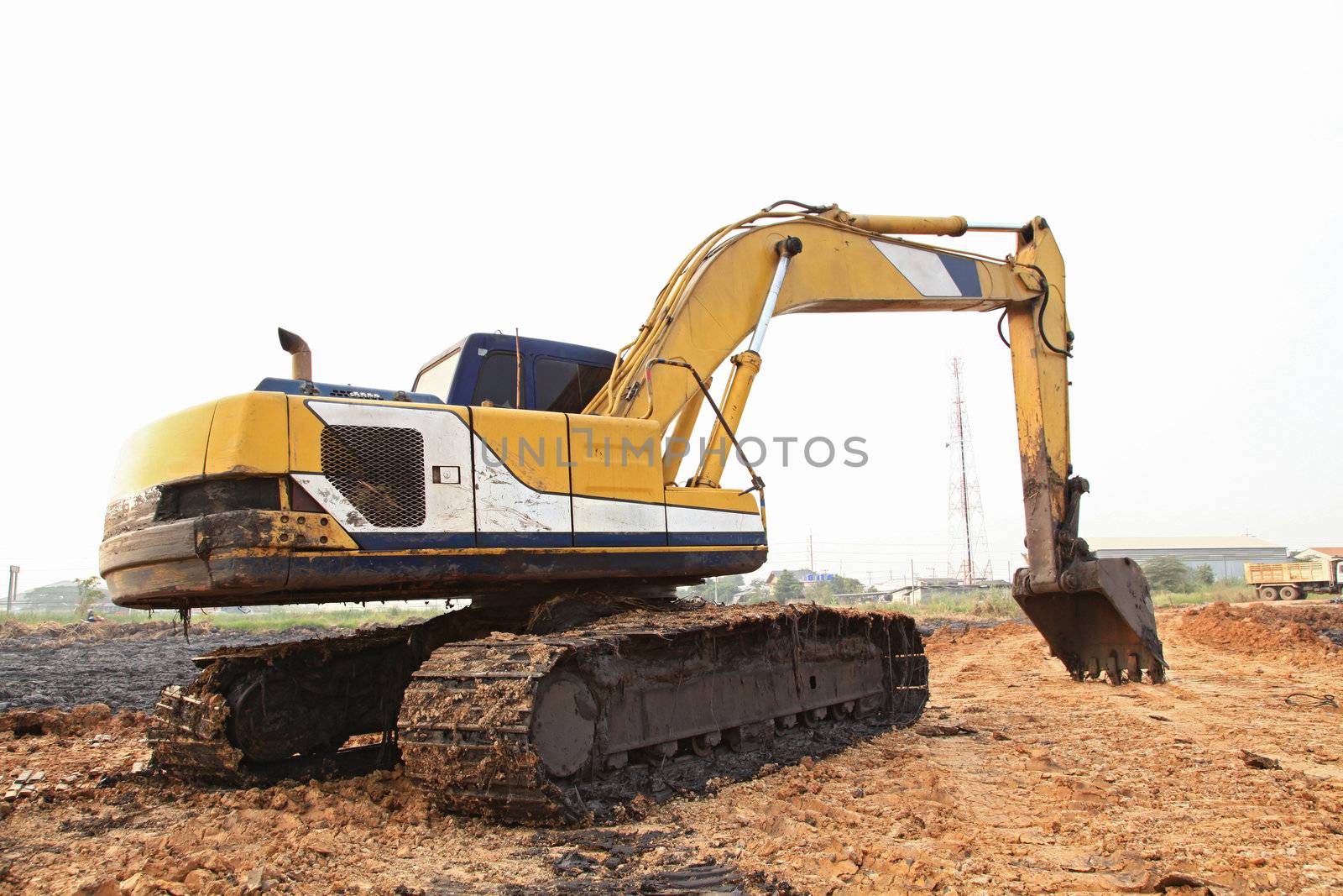Excavator Loader with backhoe standing in sandpit