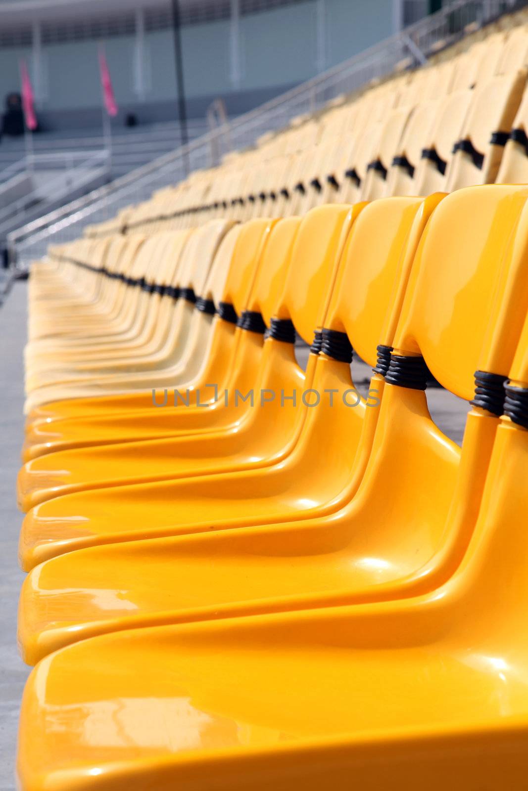 perspective of yellow seat in stadium