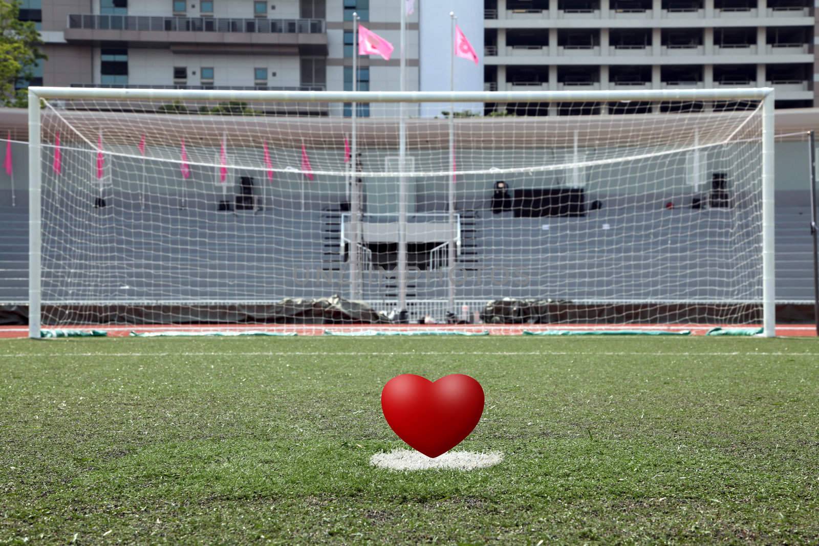 perspective of penalty spot of soccer field with heart