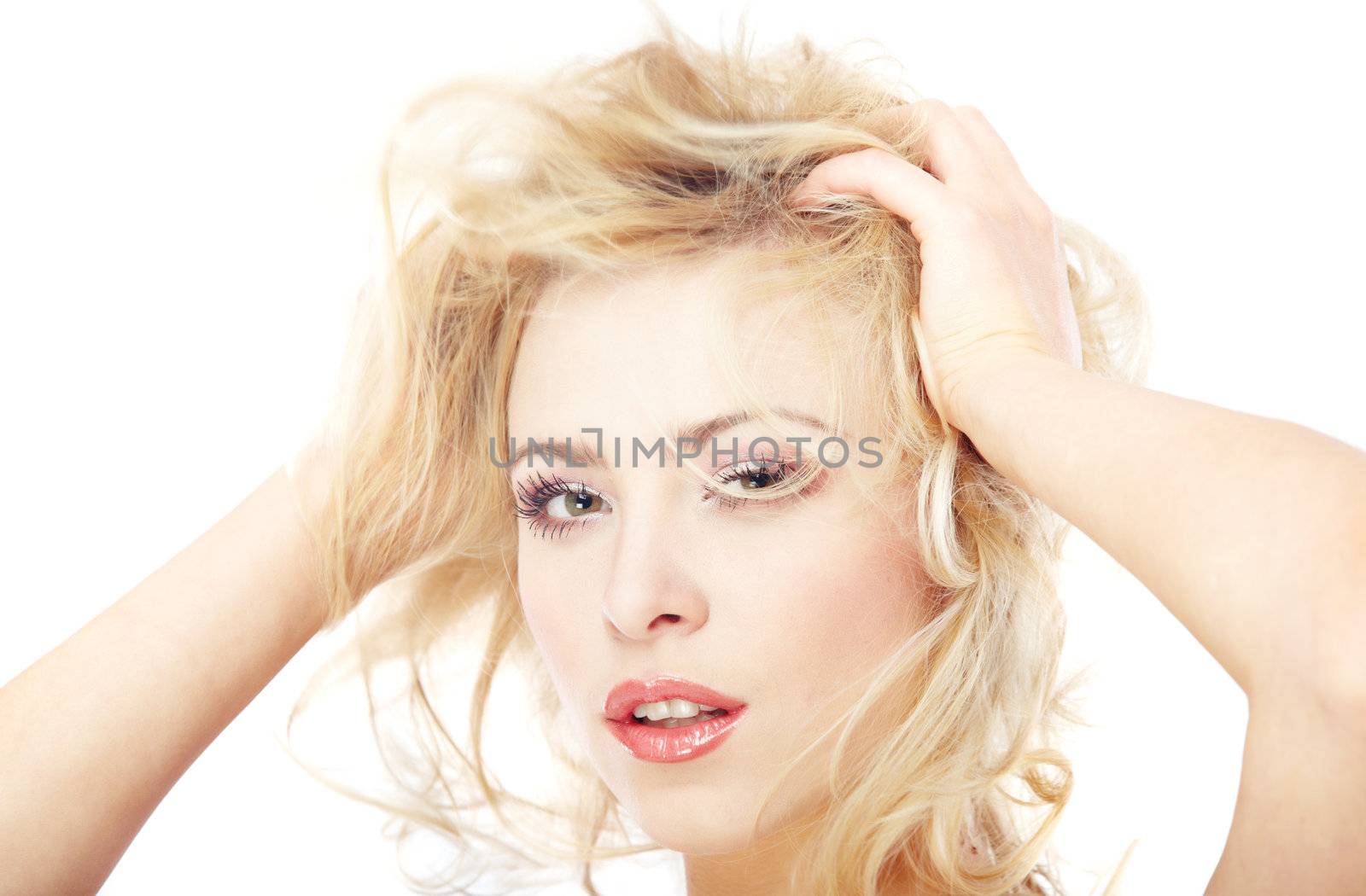 Headshot of the blond lady with perfect makeup on a white background