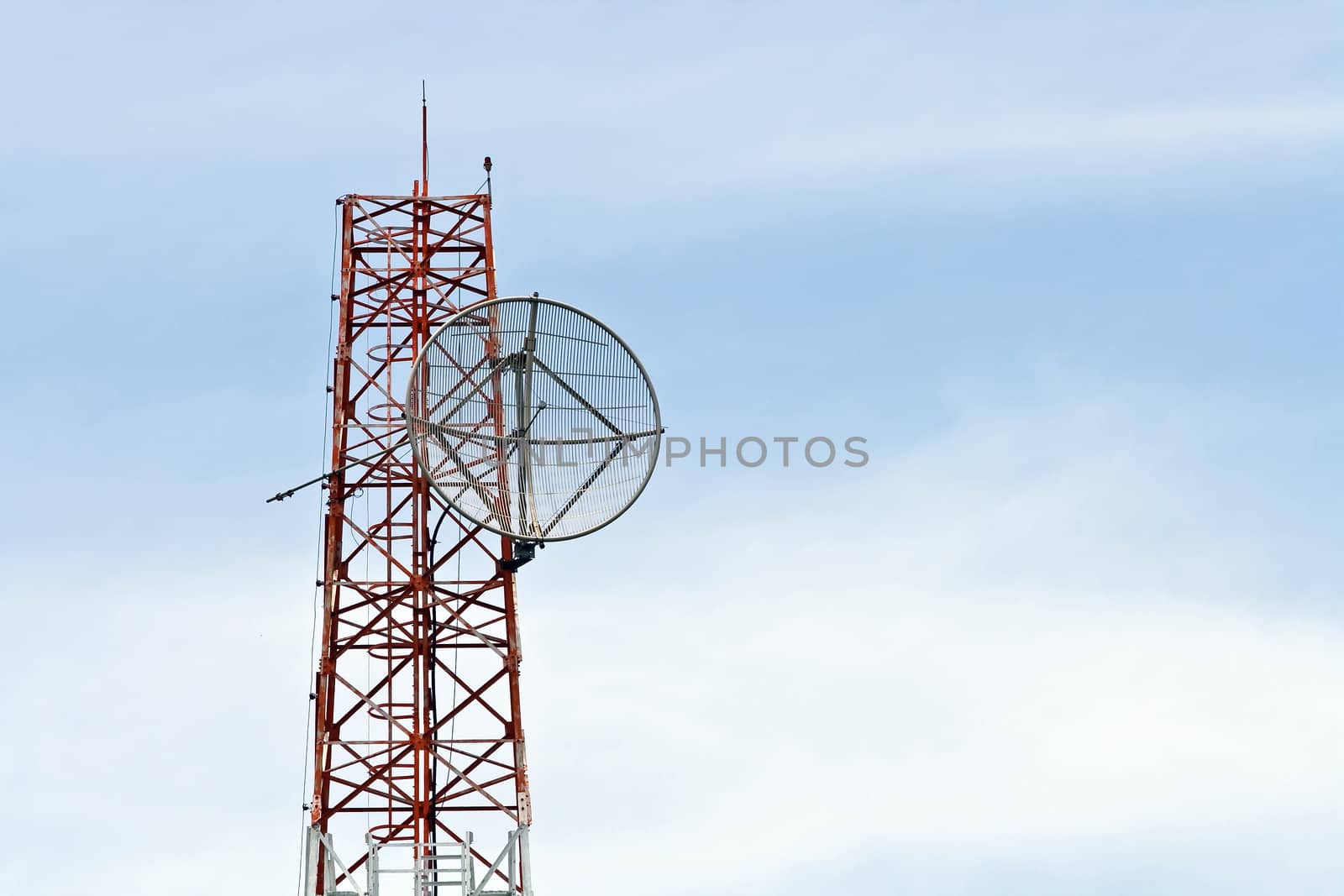 Satellite Dish on Telecommunication Radio antenna Tower with blue sky