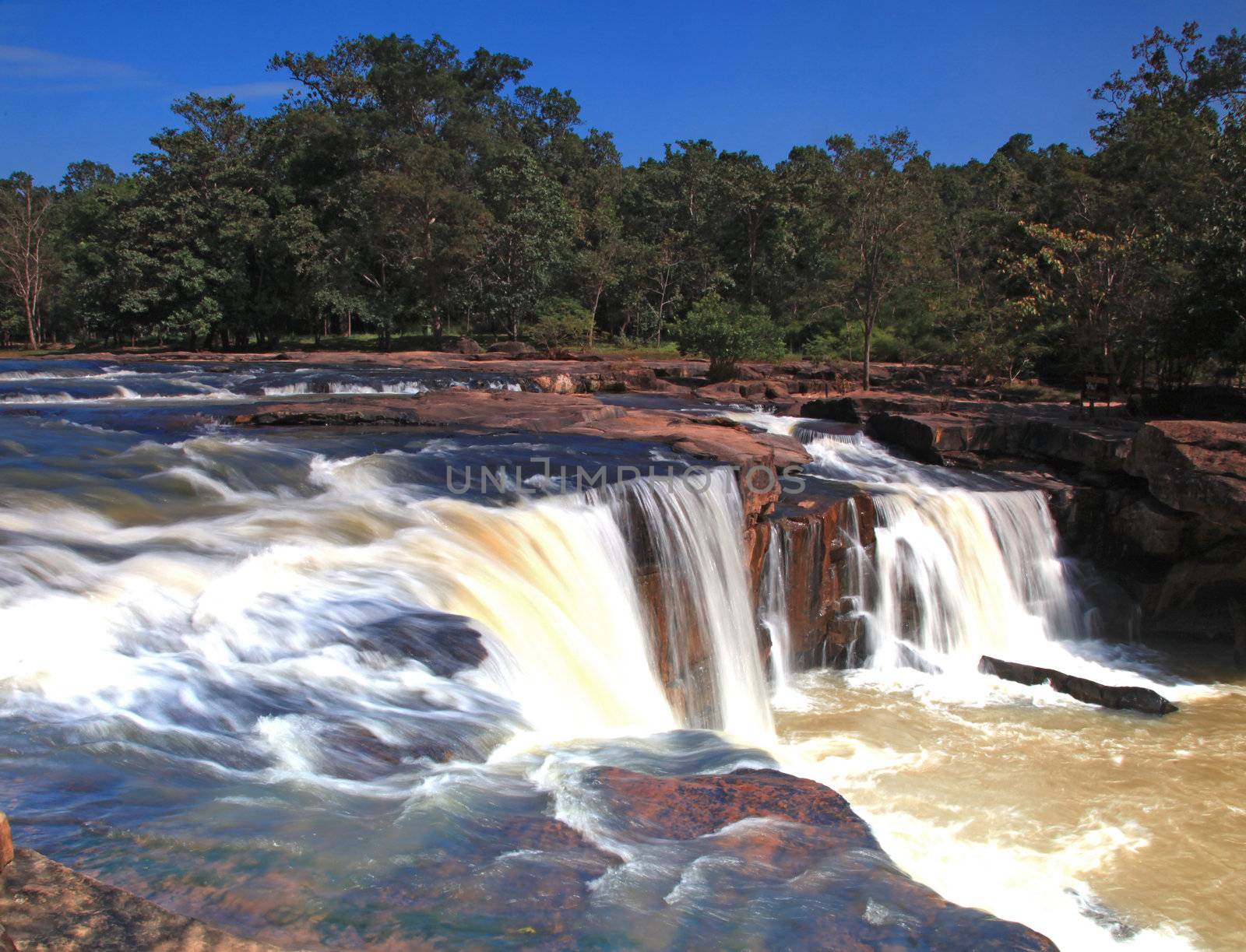 closeup of waterfall Tadtone in climate forest of Thailand from top perspective