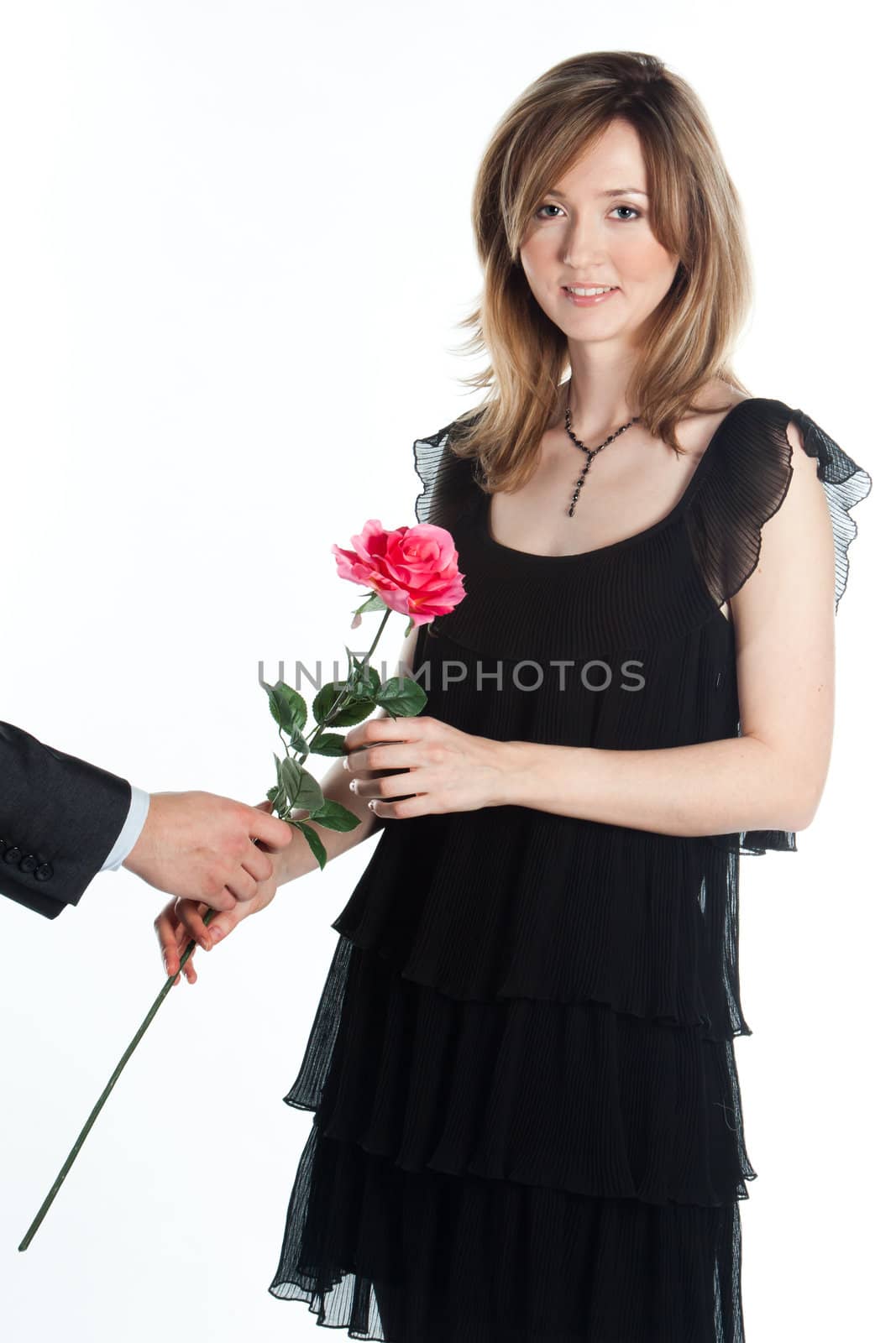 portrait of a young and beautiful girl with a gift and a rose